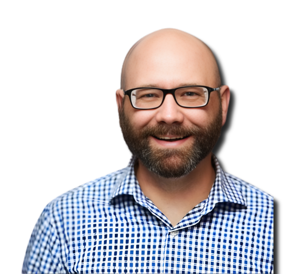 Smiling man with a beard and glasses wearing a blue checkered shirt.