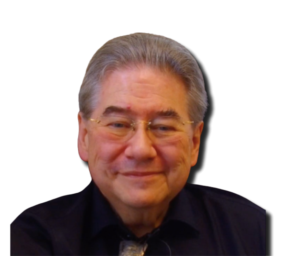 A smiling elderly man with gray hair, glasses, and wearing a black shirt, against a black background.