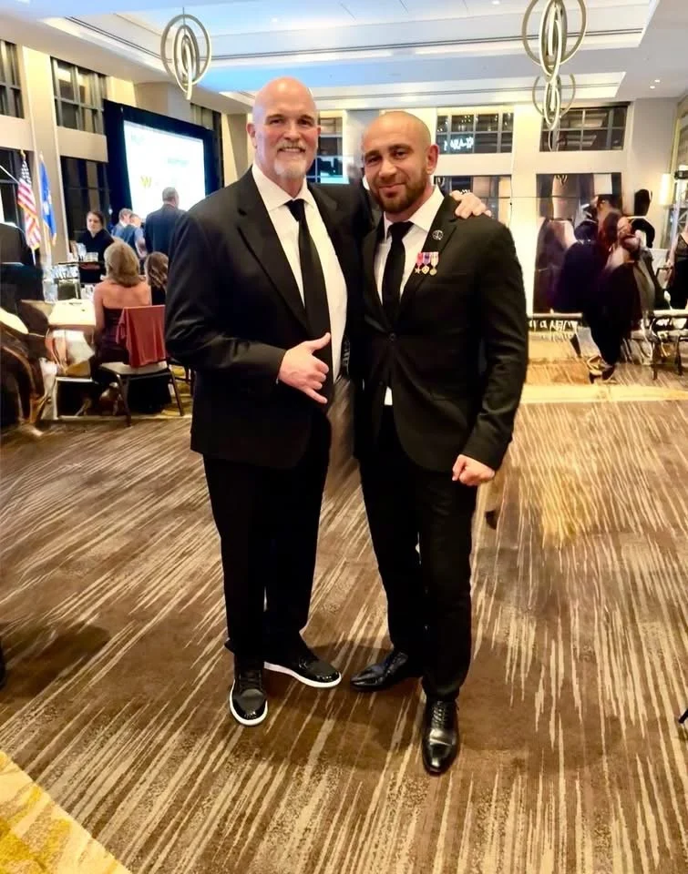Commanders Coach Dan Quinn with Liberty Speaks speaker, Pasha Palanker 