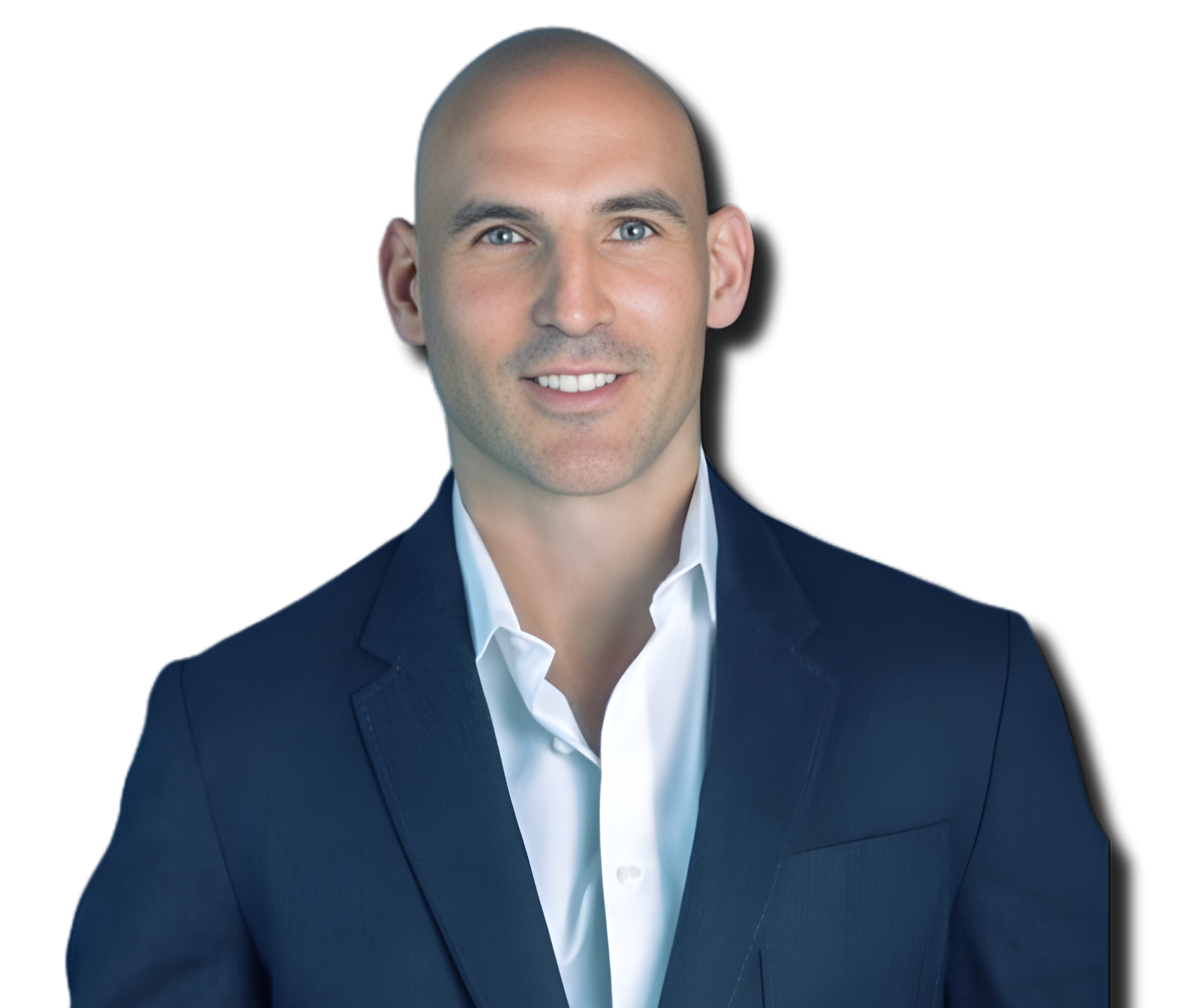 A man with blue eyes, bald head, and light skin wearing a navy blazer and white dress shirt, smiling against a plain white background.
