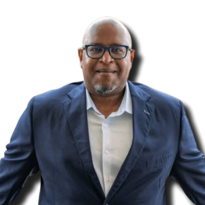 A middle-aged man with glasses, a goatee, and a bald head, wearing a blue blazer and a white shirt, smiling at the camera.