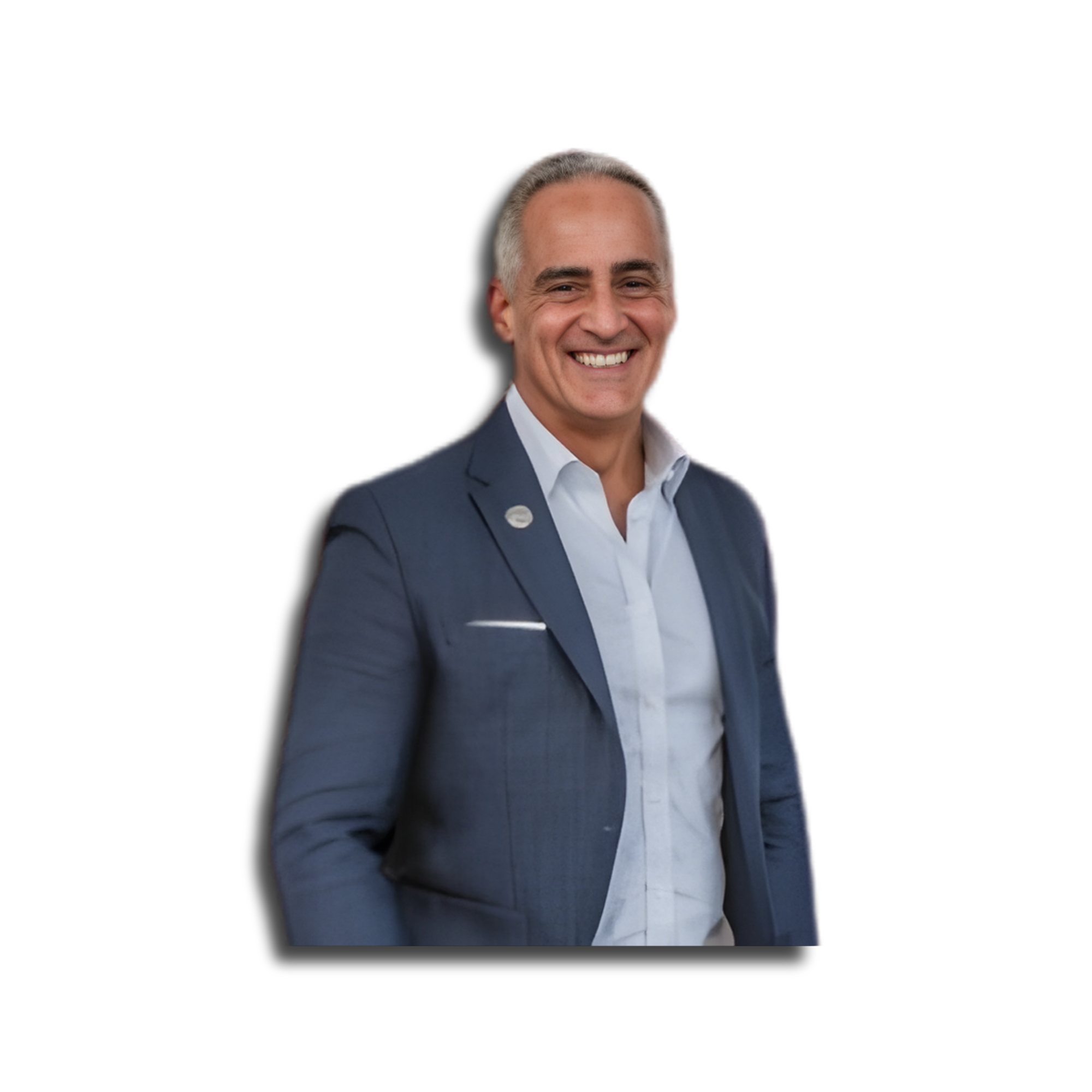 A smiling man in a business suit with gray hair, wearing a white shirt and blue blazer, against a black background.