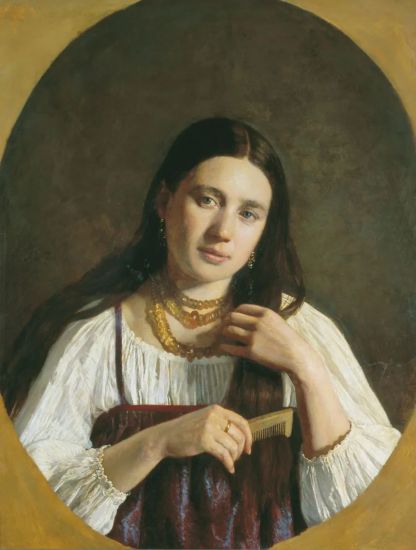 A woman with long dark hair, wearing a white blouse, gold jewelry, and a maroon dress, holds a hair comb and looks at the camera with a gentle expression.