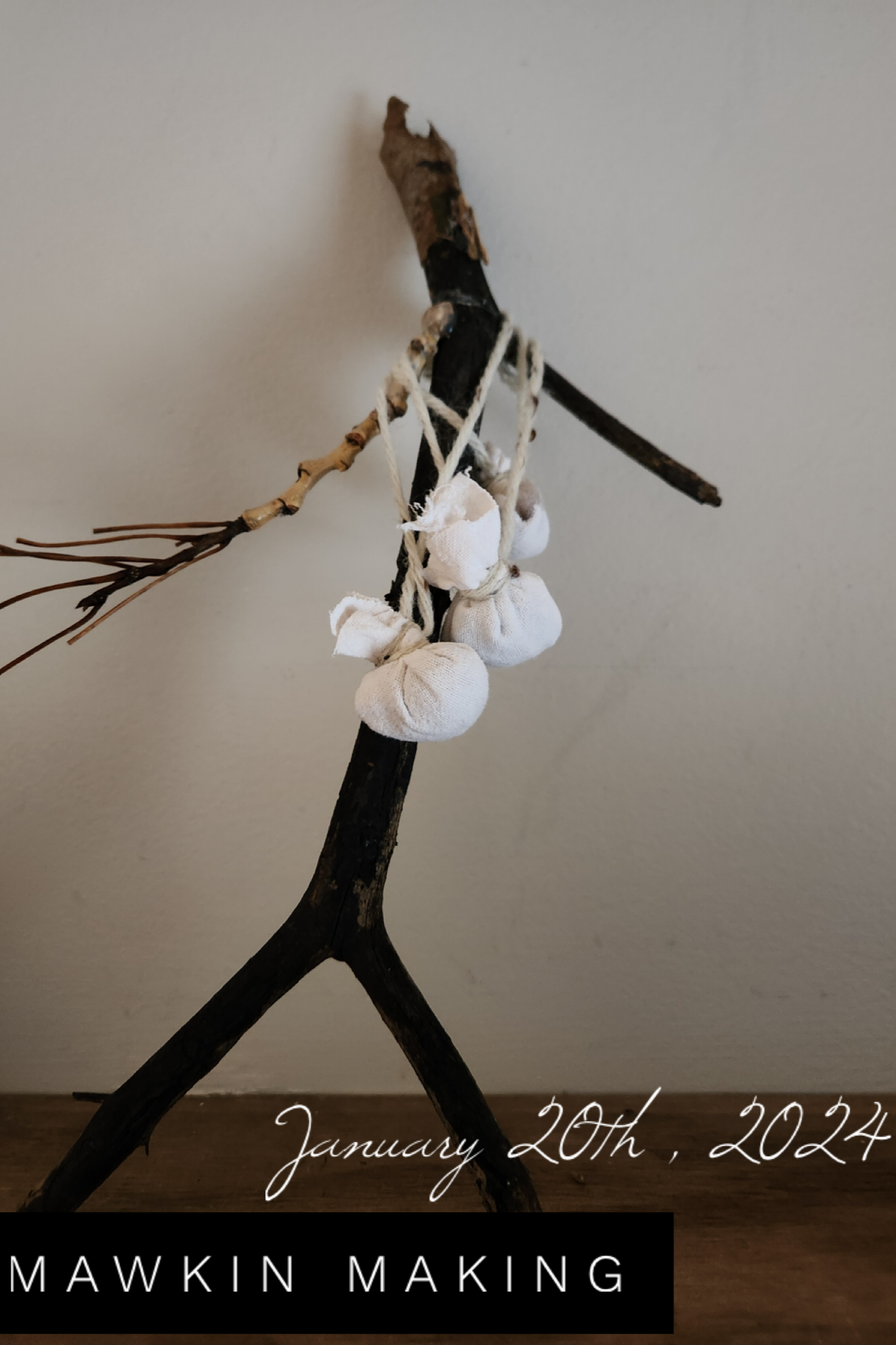 A handmade craft resembling a stick figure zebra made from twigs, fabric, and yarn, with the date January 20th, 2024, and the text 'MAWKIN MAKING' at the bottom.
