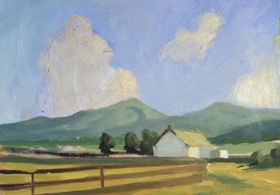 Oil painting of a rural landscape with green mountains, a blue sky with a few clouds, a small white house with a yellow roof, trees, and a wooden fence in the foreground.