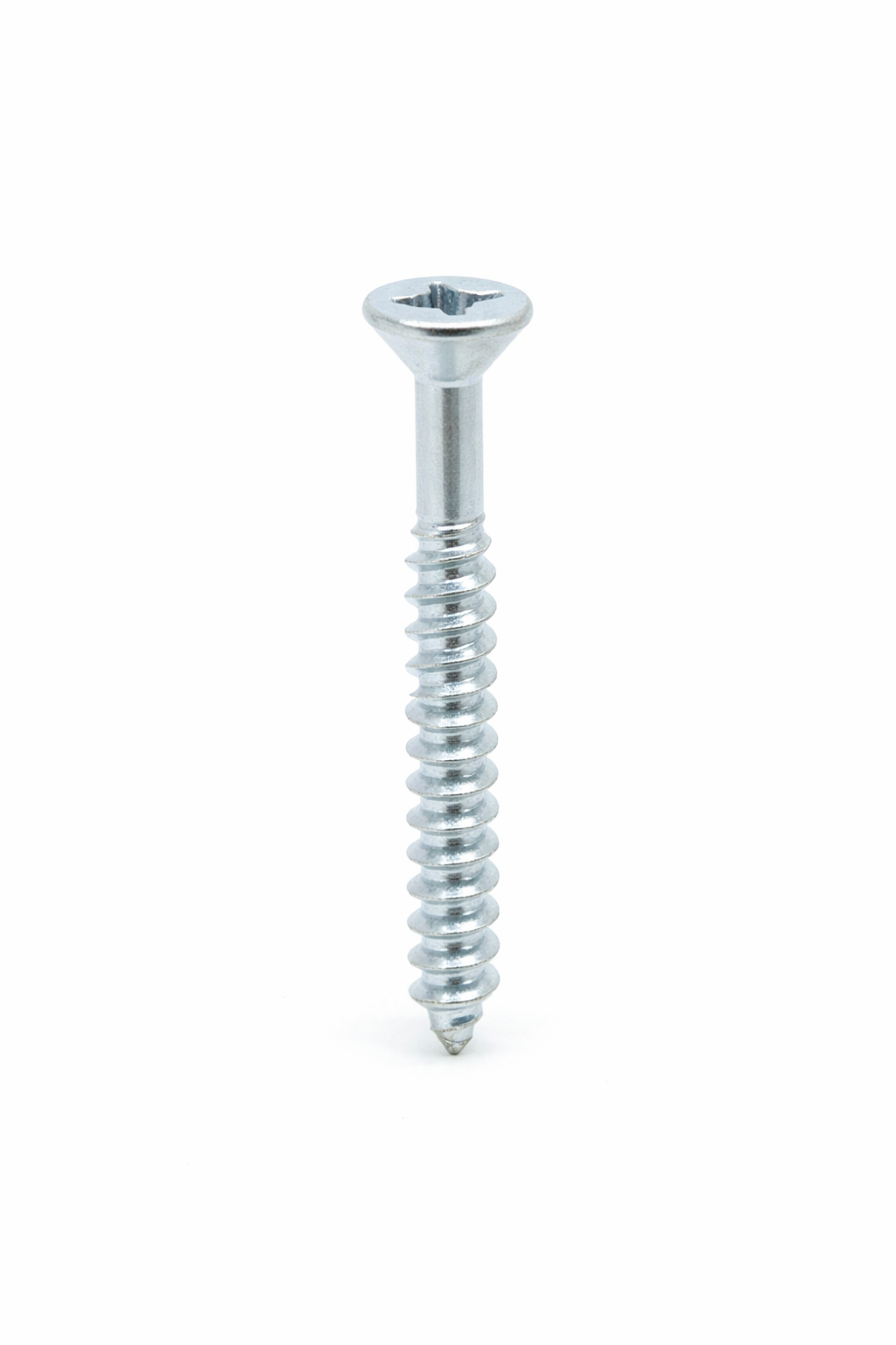 A metallic screw with a flat Phillips head and threaded body isolated on a white background.