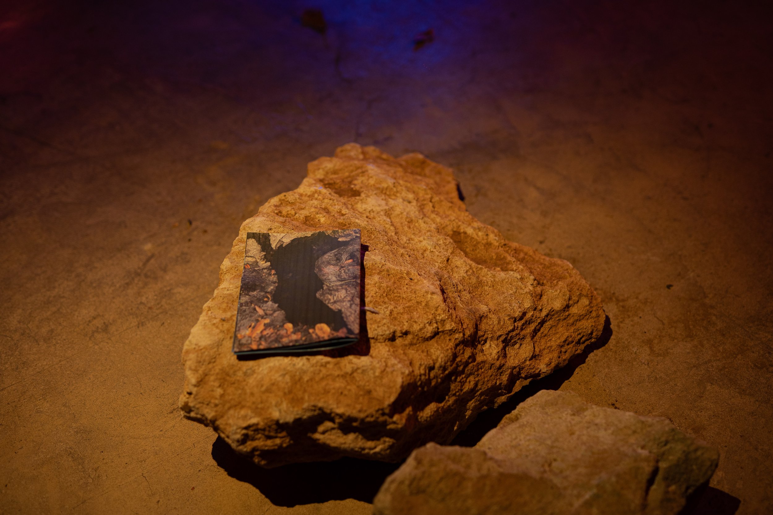 Found rock used as sitting and zine