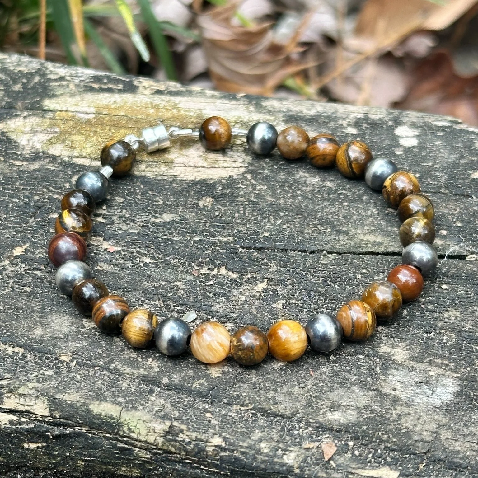 Eight new bracelets, and Saturday is the first time any of them leave the bench.

Lapis and pyrite. Onyx and pyrite. Tiger's eye with hematite and lava. Chrysocolla with Bali silver. Turquoise and lava, two different ways.

Eight went up this week, $