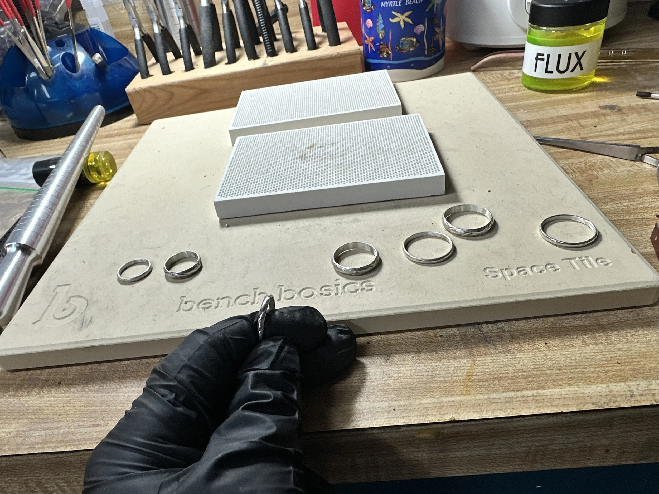 Hand-forging a sterling silver band in the Ramble and Riot studio