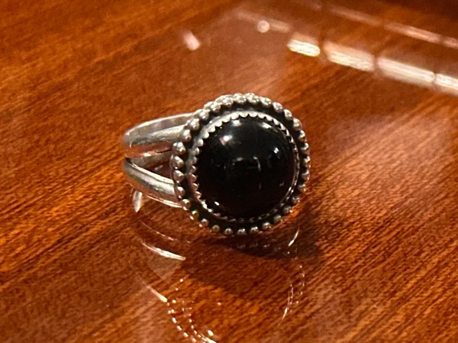 Diverging Paths // Onyx Statement Ring placed on a guitar.