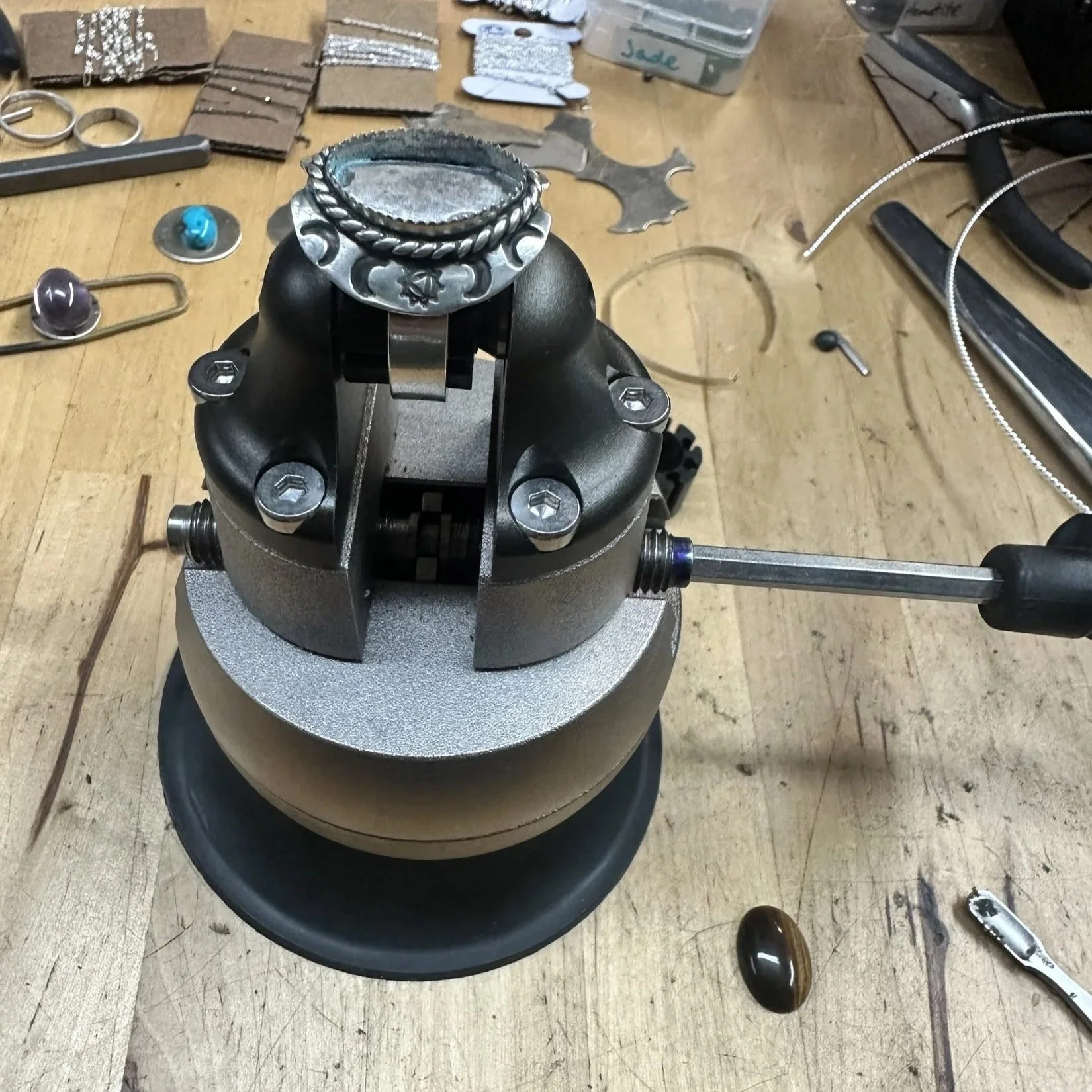 Shield ring held in a ball vise with the bezel still empty
