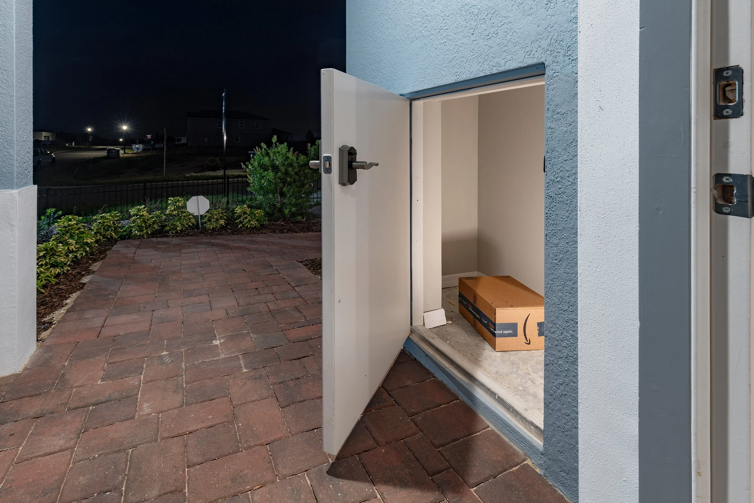 Trinity Package Place built-in outdoor storage area with secure delivery door and electronic keypad door lock 