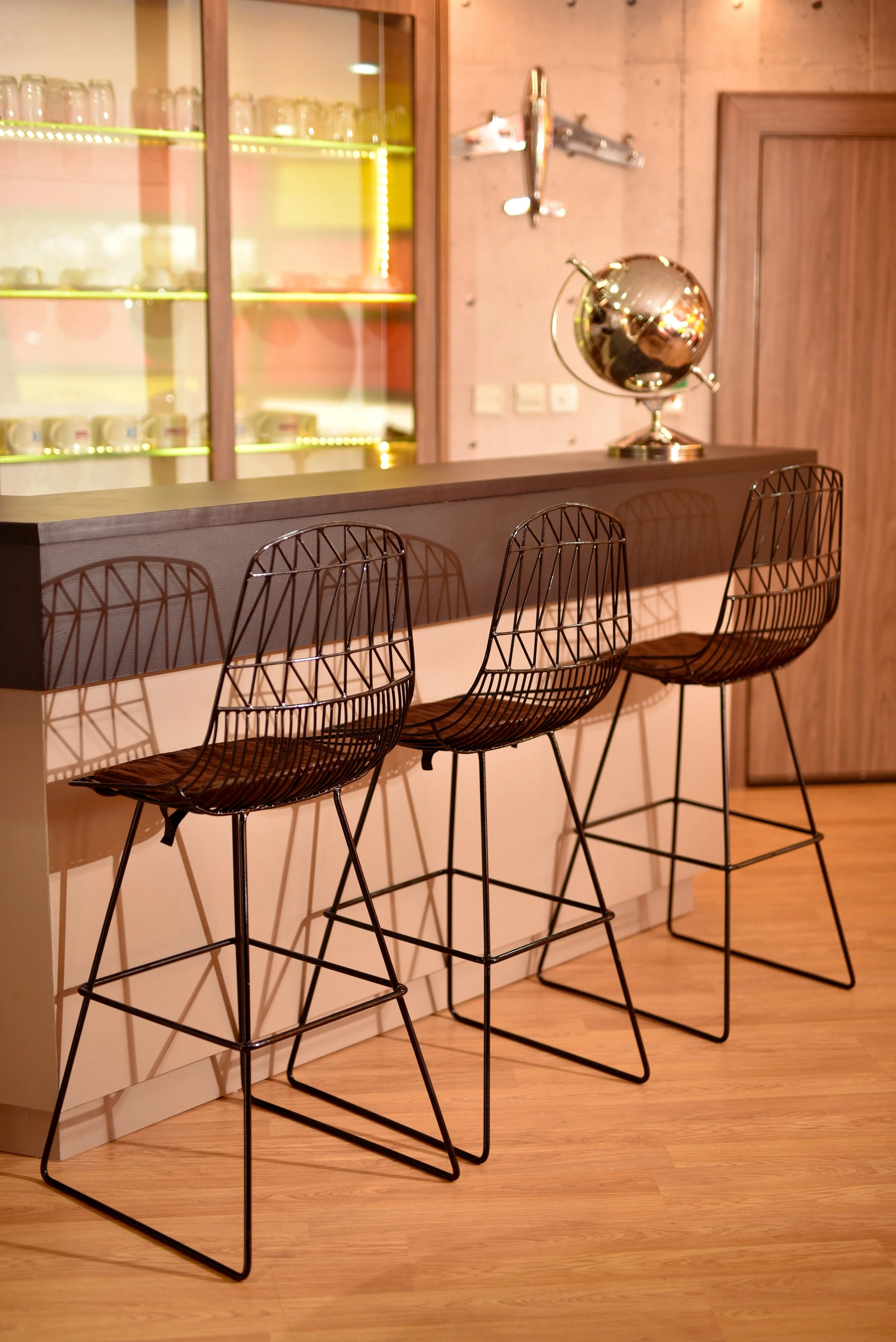 Breakout. bar with high stools and wood bar table designed and made by LHODesign for Sahara PJ pilots