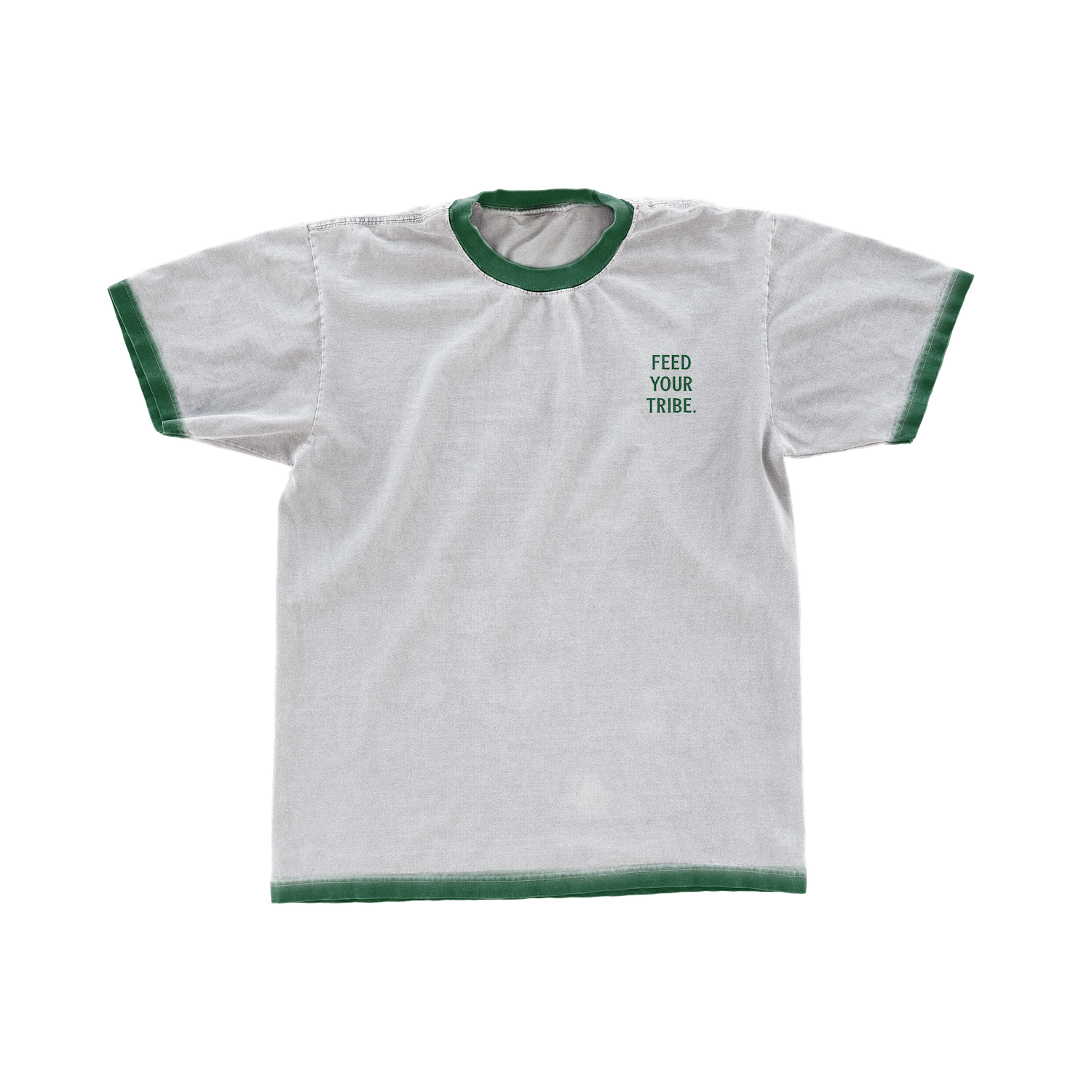 A white T-shirt with green trim around the collar and sleeves, featuring the phrase "FEED YOUR TRIBE." printed on the front.