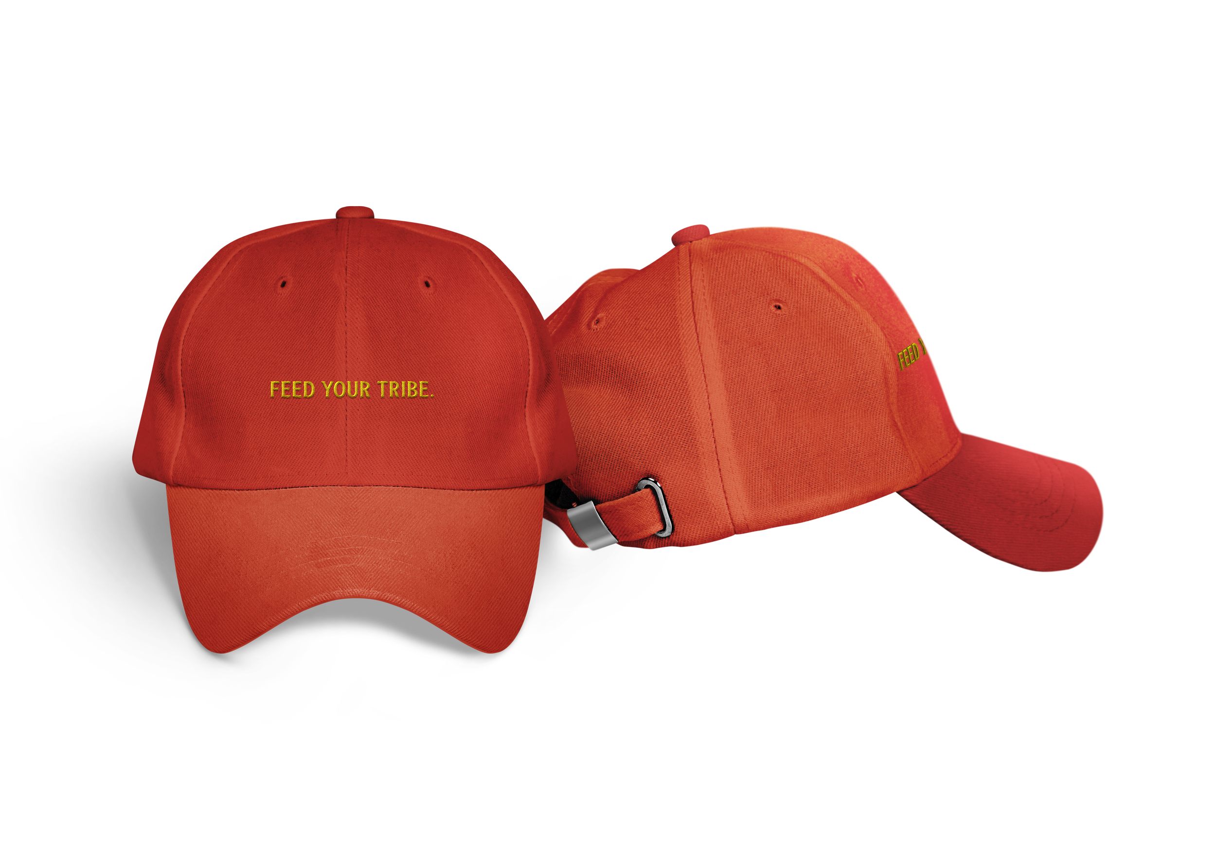 Red baseball cap and orange baseball cap with the embroidered yellow text "FEED YOUR TRIBE" on the front, positioned against a plain background.