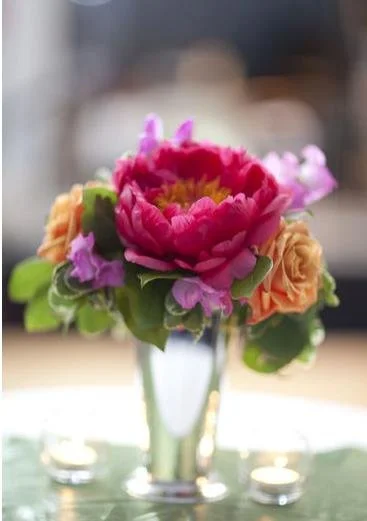 Colorful flower arrangement in a glass vase on a table