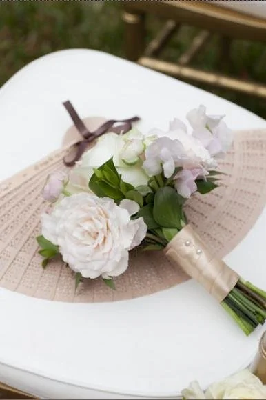 A bridesmaid bouquet of white and light pink flowers