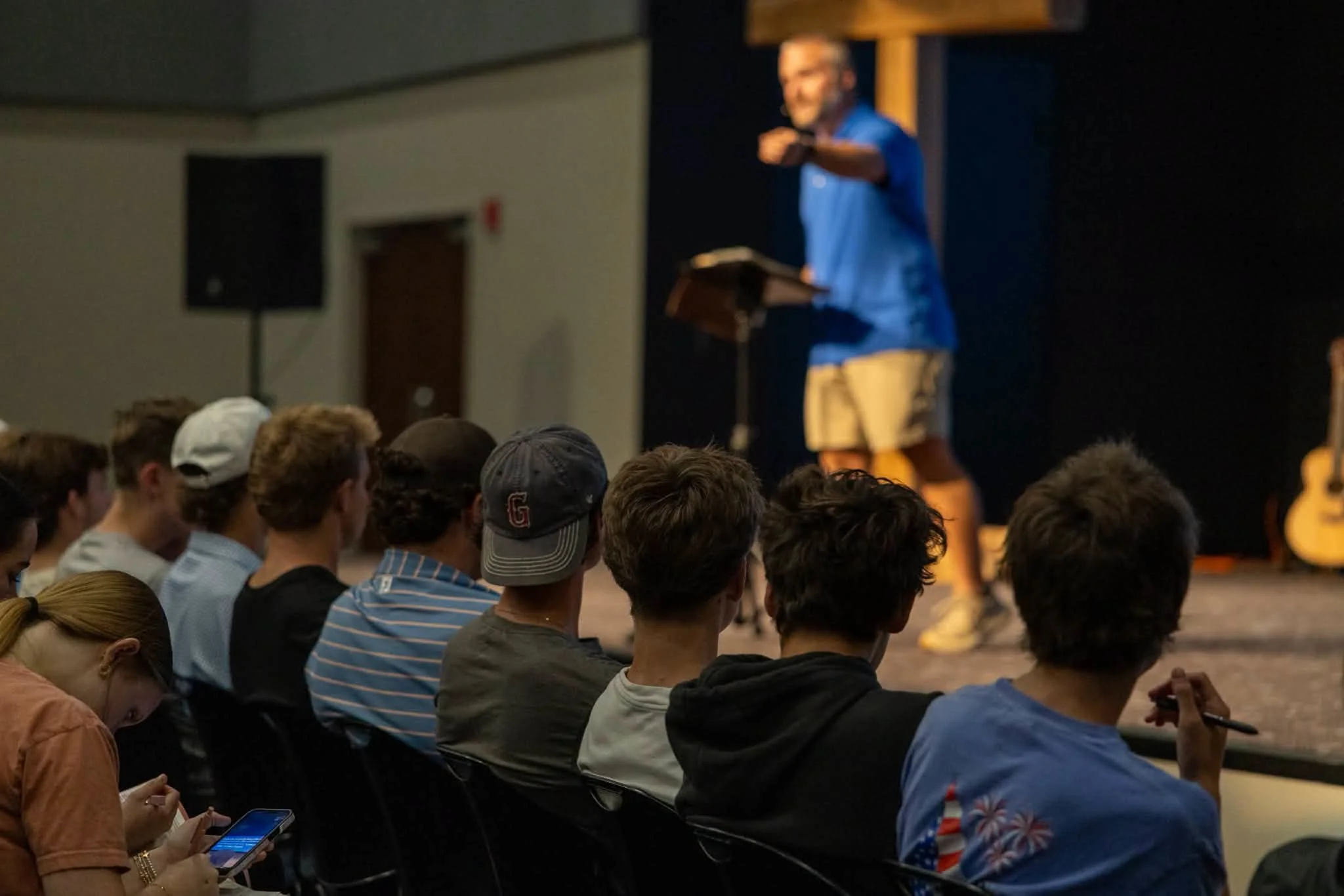 Students listening during a student ministry worship night