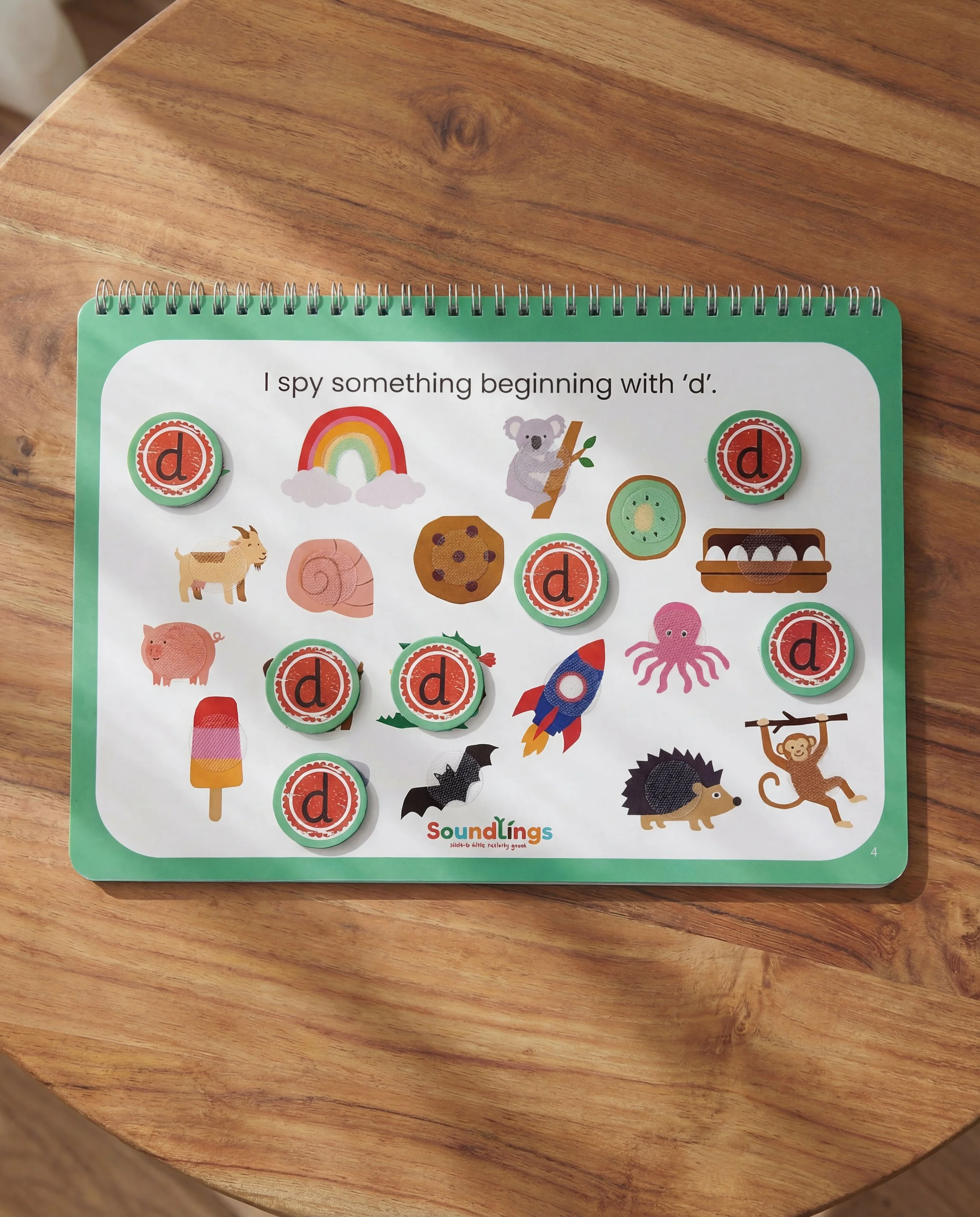Phonics activity busy book two sorting task with moveable pieces in laminated colourful wire bound book to develop Phonics knowledge of phase two sounds. initial sound task for children aged 3 plus.