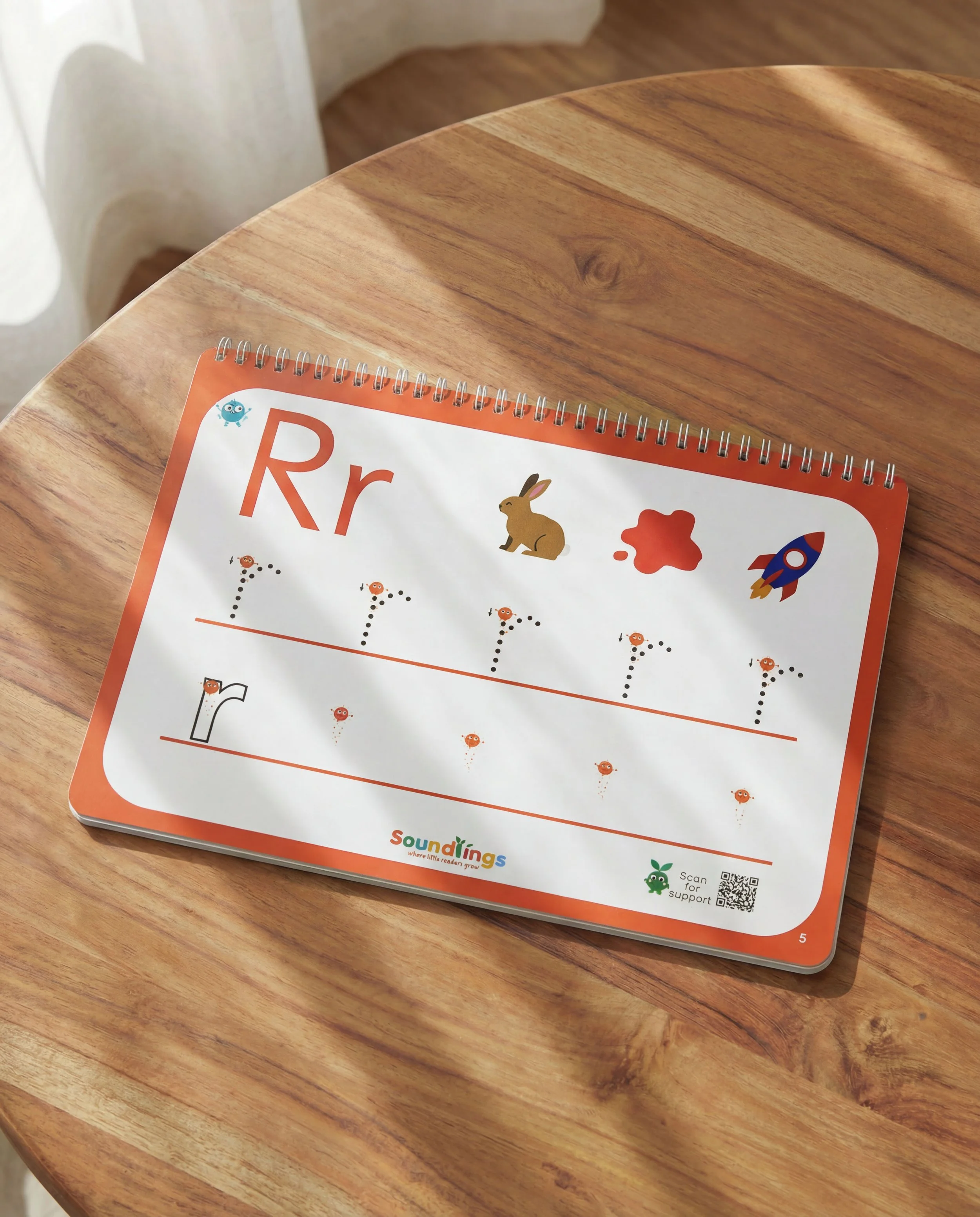 Phonics activity busy book three letter formation task with handwriting practice and images in laminated colourful wire bound book to develop Phonics knowledge of the sounds. For children aged 3 plus.