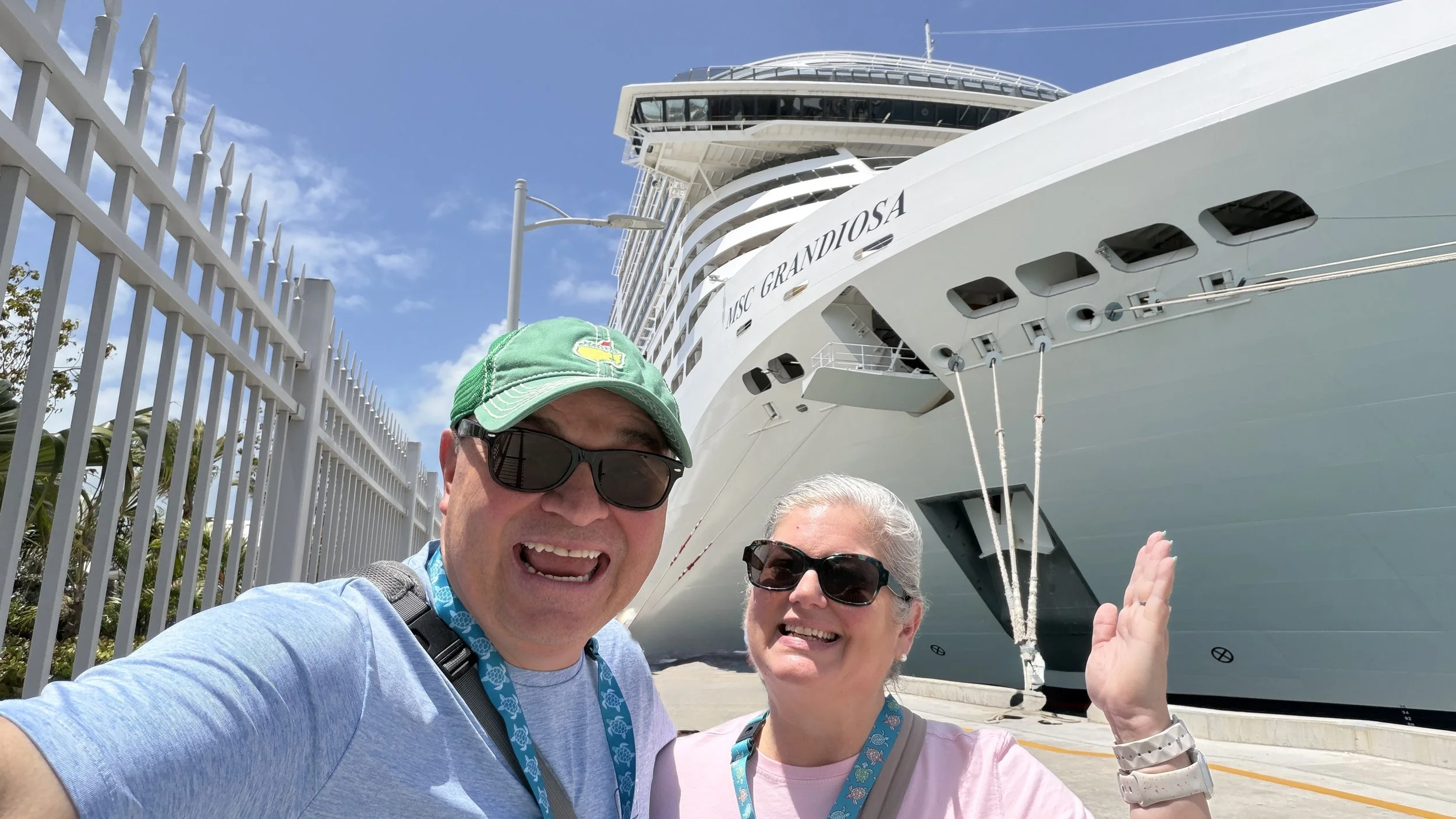 MSC Cruise ship Grandiosa in port of Nassau with smiling couple