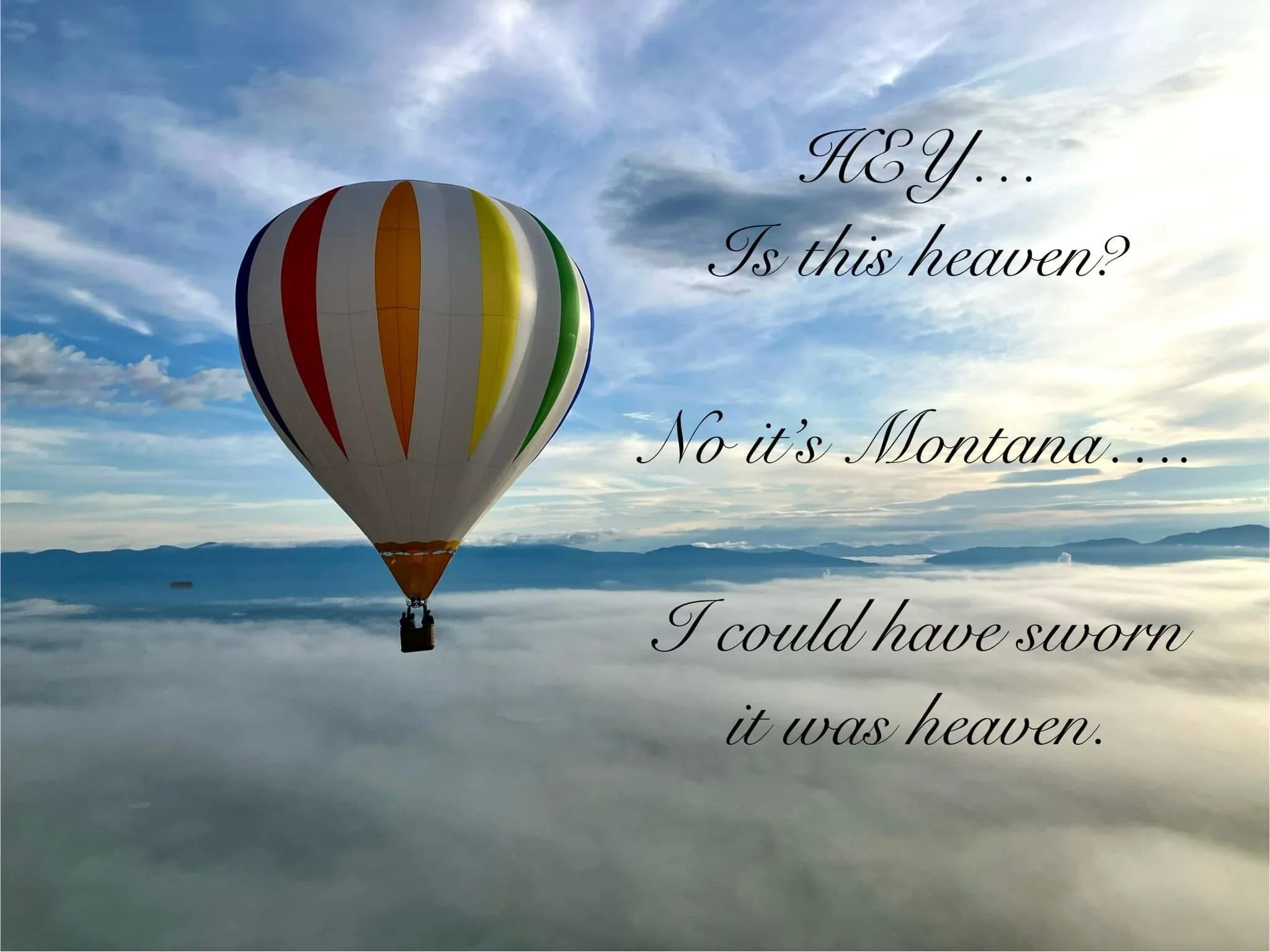 A colorful hot air balloon in flight with clouds and mountains in the distance during the morning, with romantic text overlay reading "Hey... Is this heaven? No, it's Montana..."