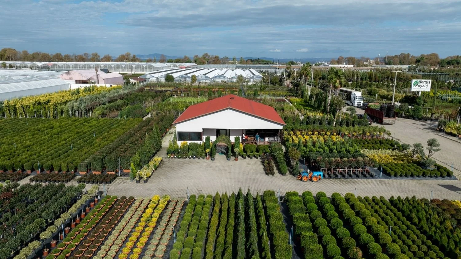 Aerial view of plant nursery with red roof building