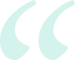Two teal quotation marks on a black background