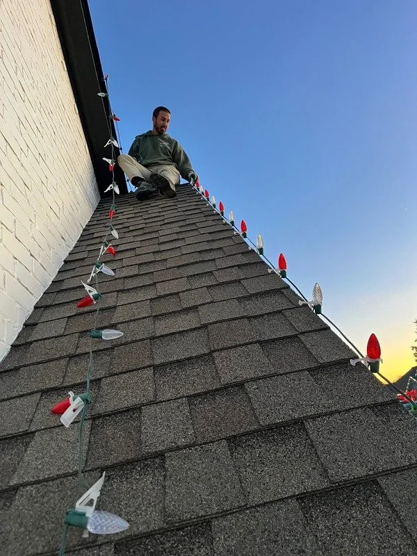 Daniel Putting up lights.jpg