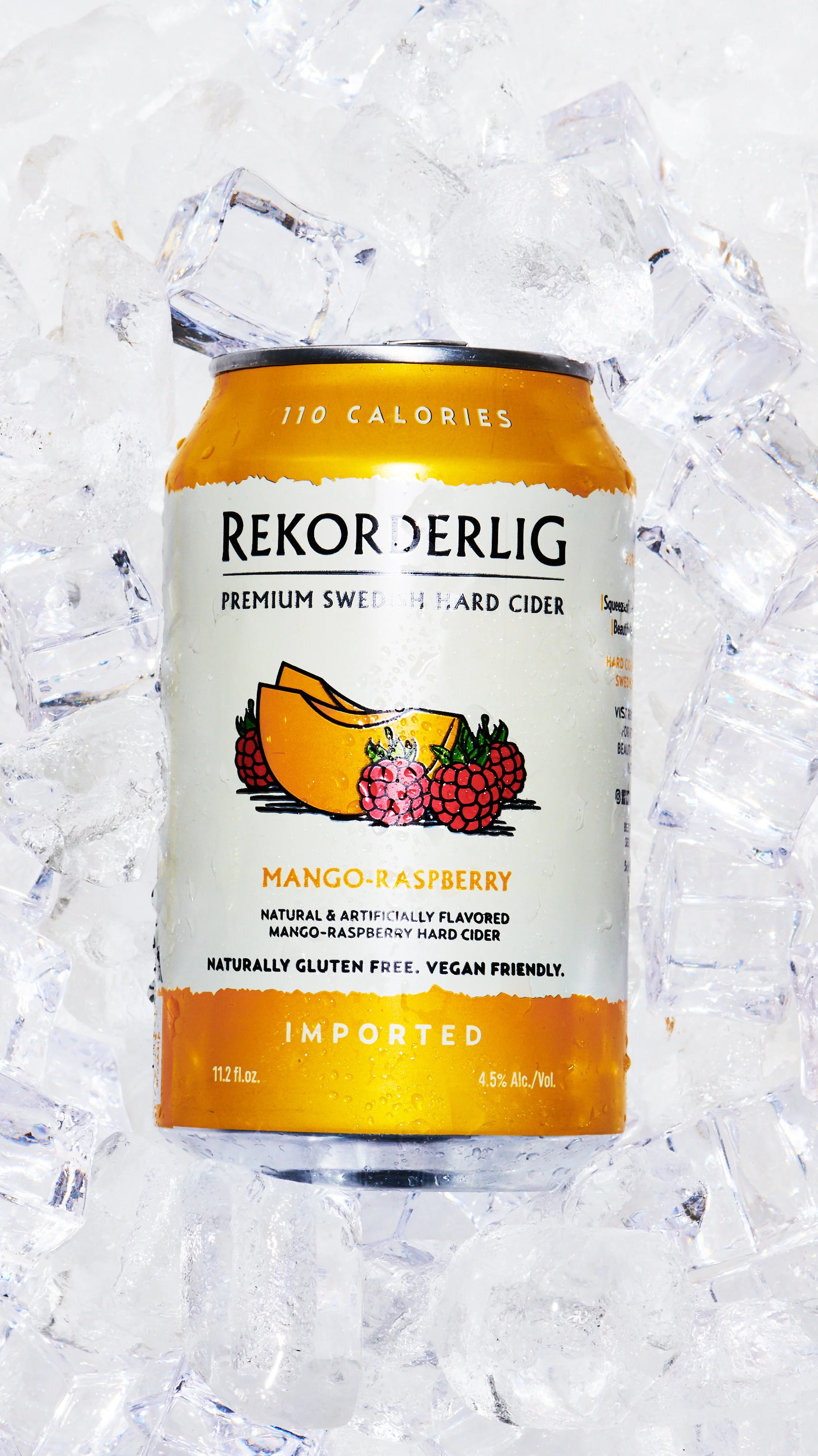 Can of Rekorderlig Mango Raspberry hard cider surrounded by ice cubes.