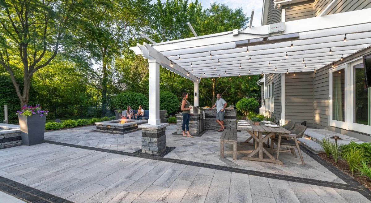 Stone patio installation with fire pit and outdoor living design in Charlottesville, VA
