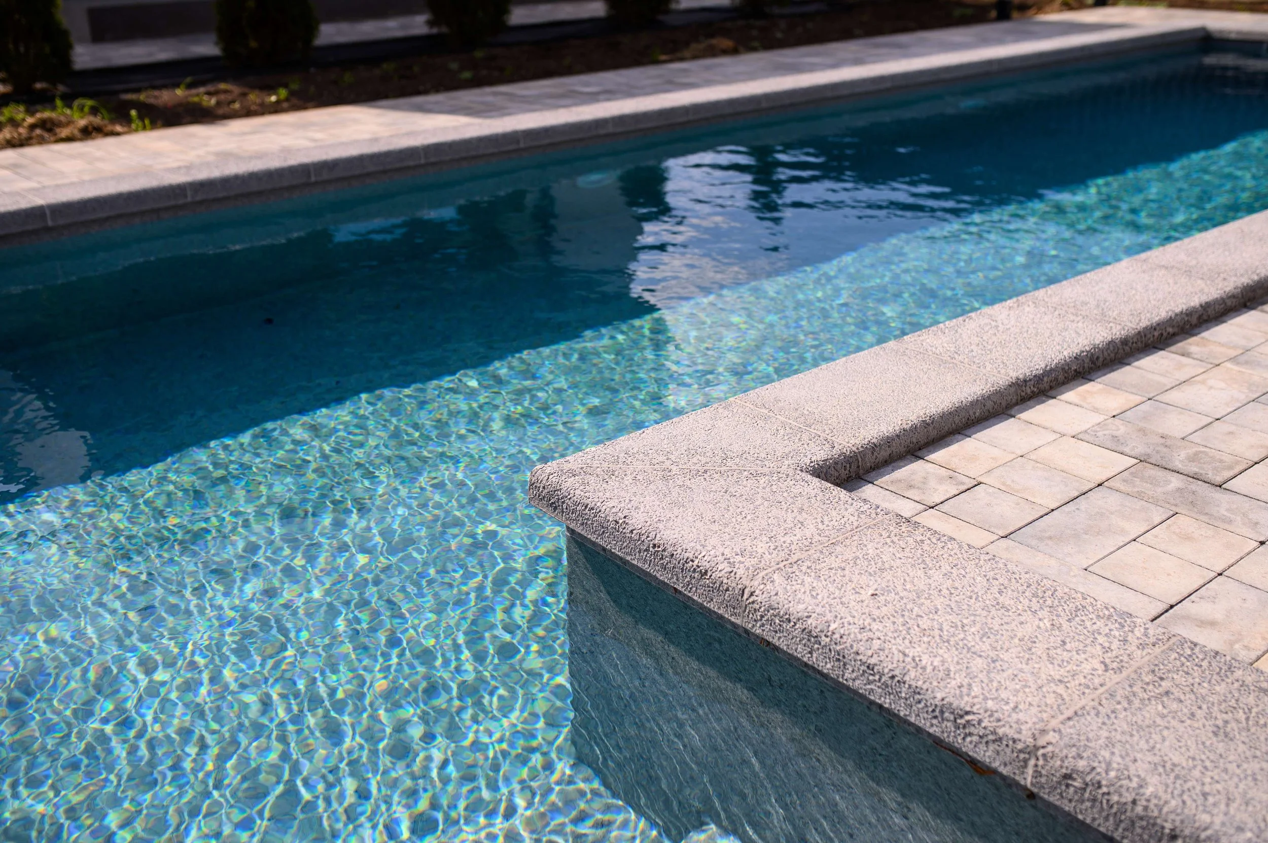 Custom pool with paver patio and outdoor living design in Smith Mountain Lake, VA