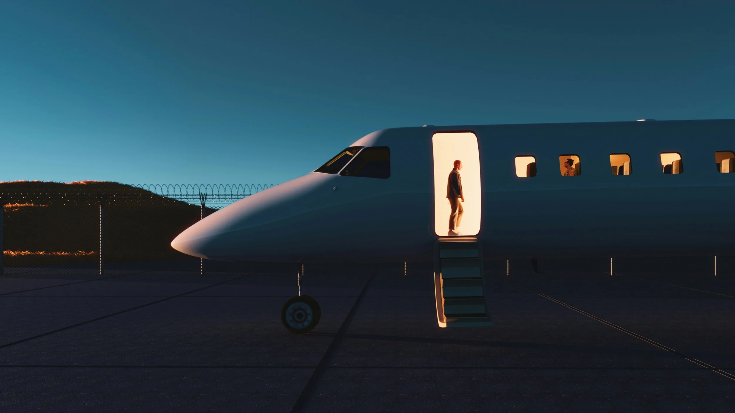 A person standing at the entrance of a modern airplane parked on the tarmac during sunset or dusk.