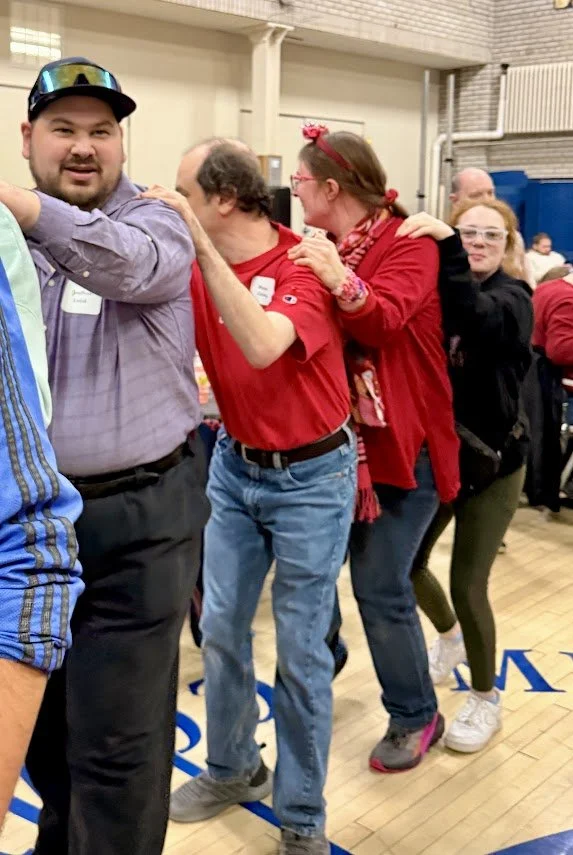 SOAR friends in the Conga line at our Valentine's Dinner Date February 2026
