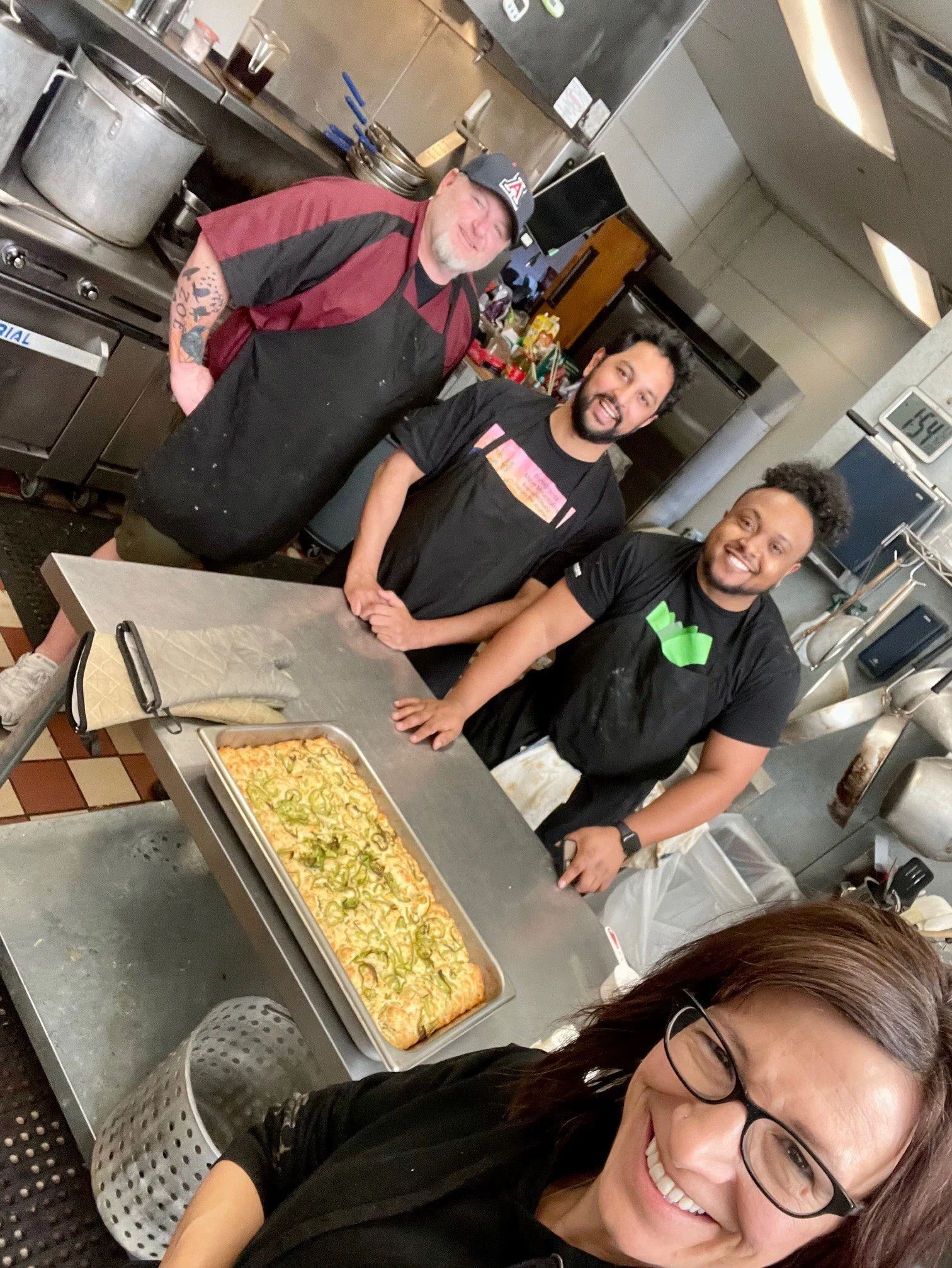 Ben and 3 of his team prepping a dinner for a fundraiser event from Benny's Catering in Greeley