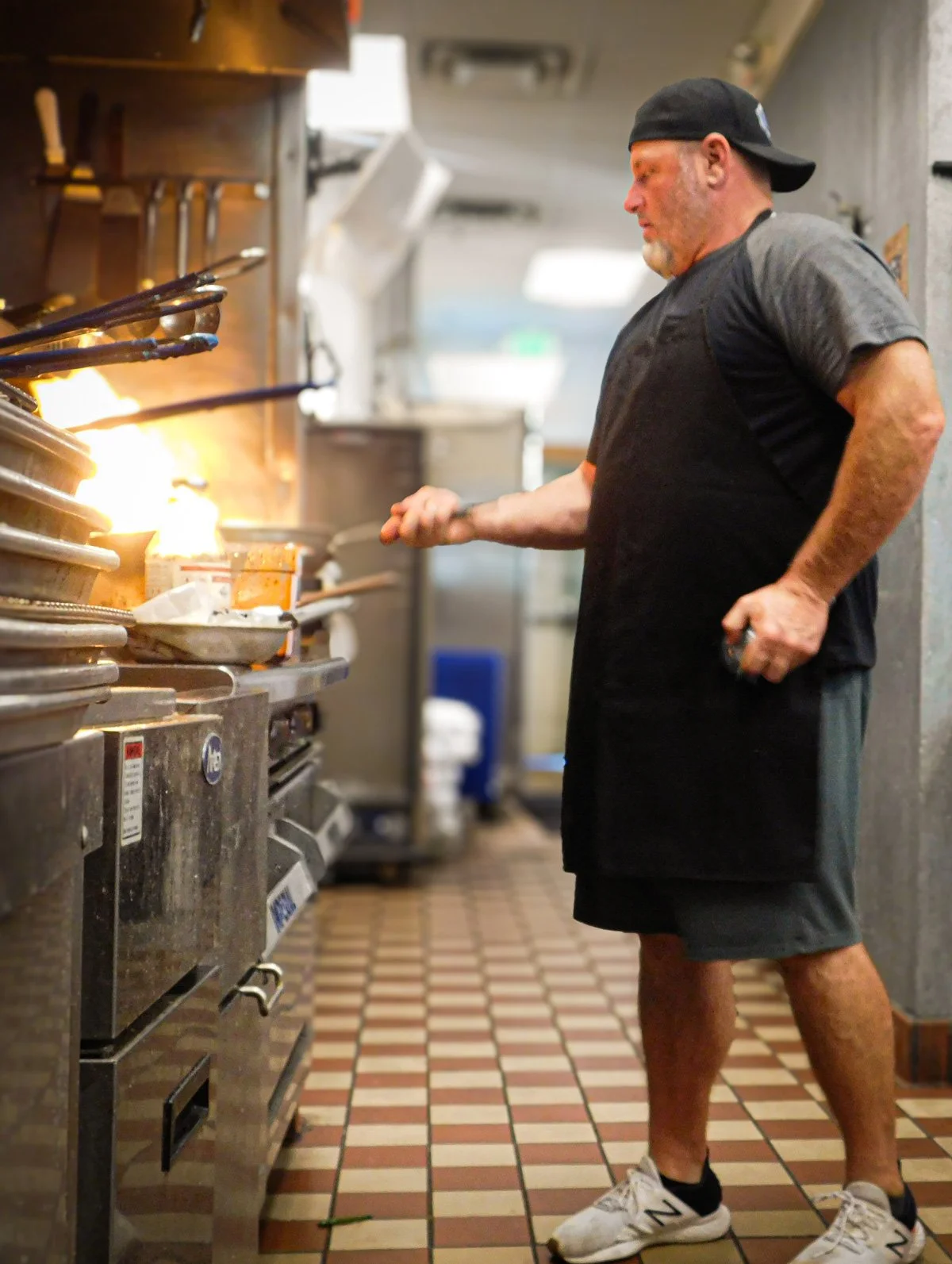 Ben in action, cooking up some crispy korean fried chicken from Benny's Catering in Greeley