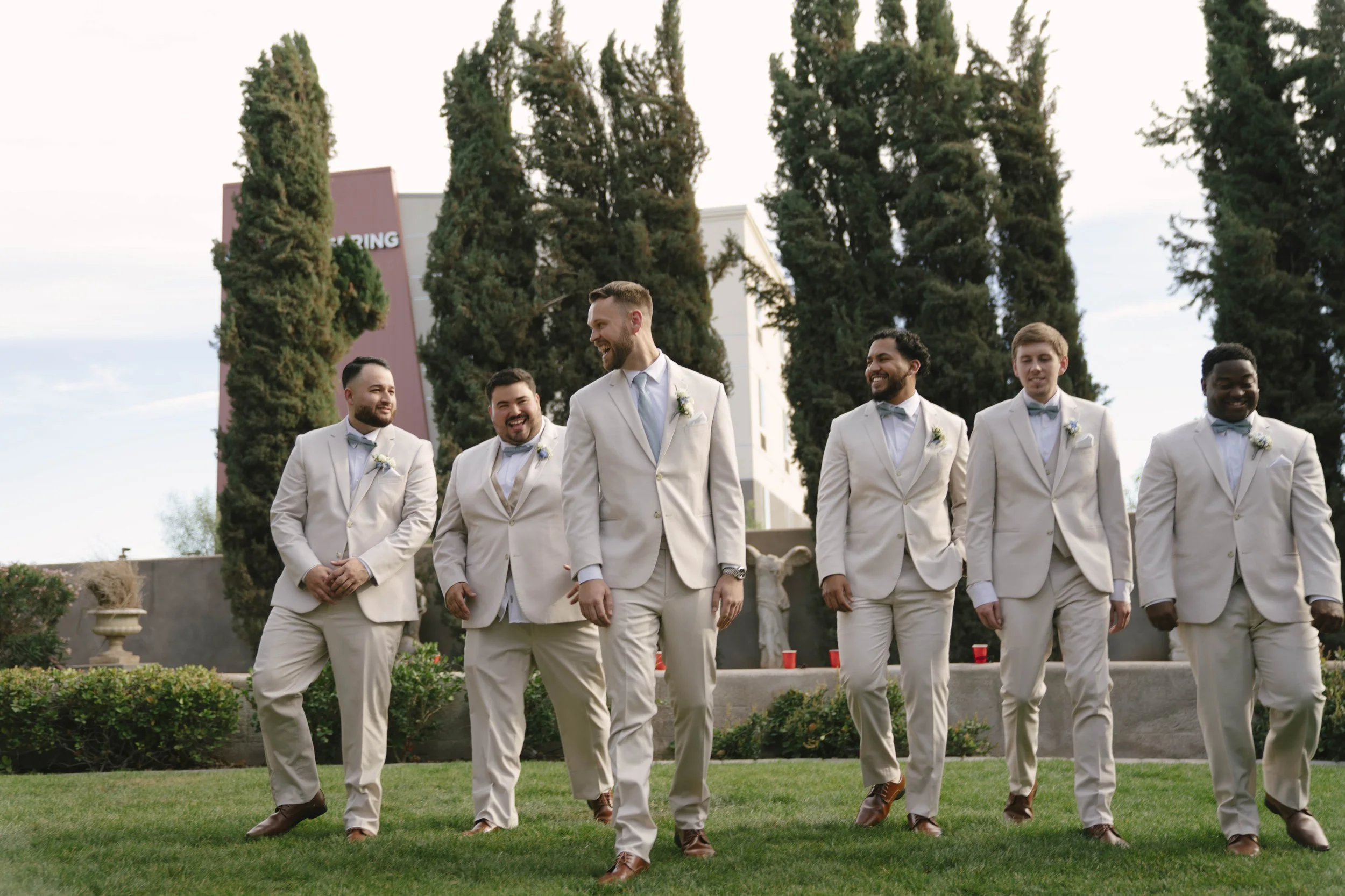 The bridal party portraits at Ashley Castle in Chandler, Arizona, brought playful energy and celebration to the day, with hybrid film and digital photography capturing candid laughter, stylish group moments, and unforgettable memories with the bride,