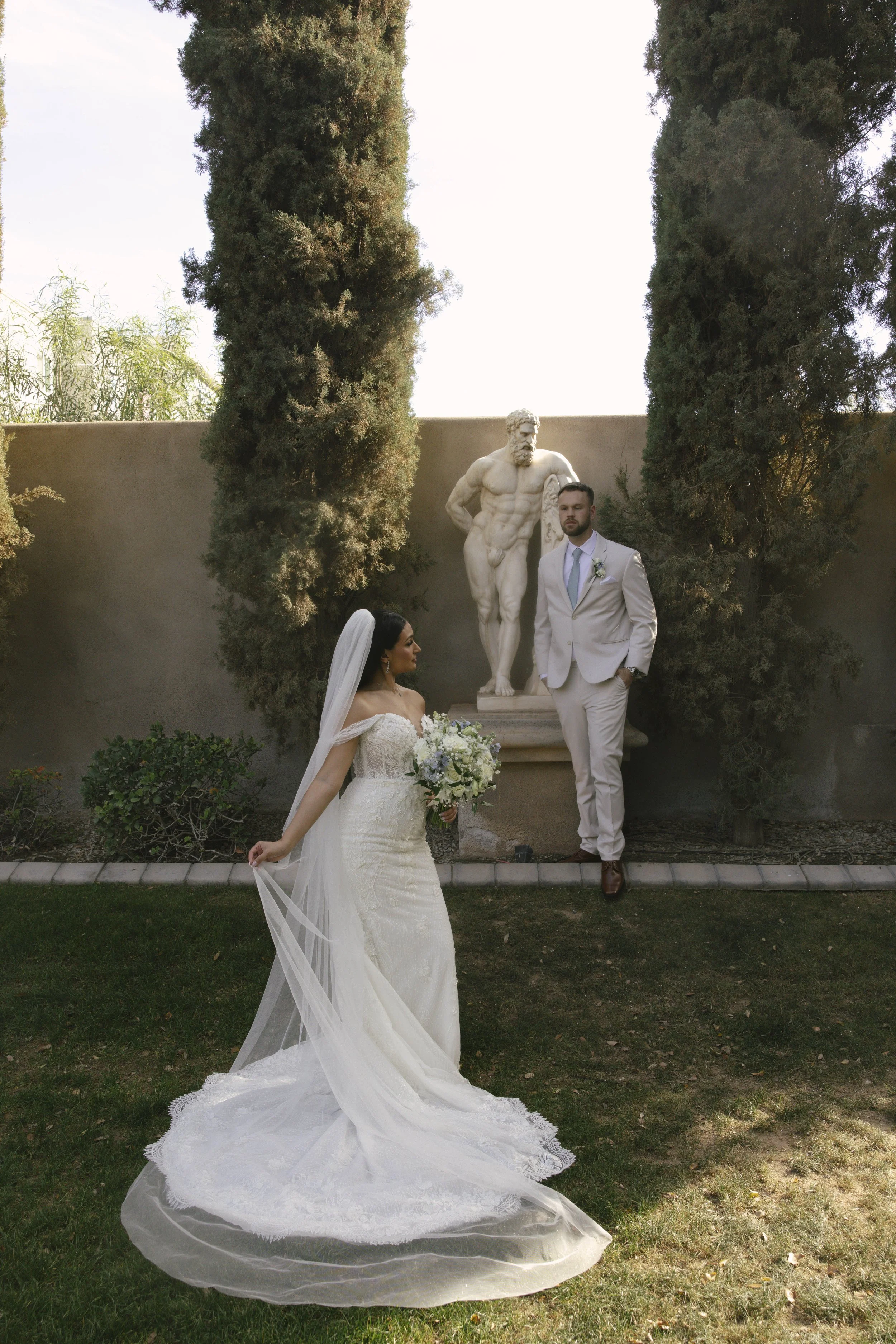 Romantic bride and groom portraits at Ashley Castle in Chandler, Arizona, captured through hybrid film and digital photography, showcase intimate newlywed moments filled with emotion, elegant garden backdrops, and timeless wedding-day connection.