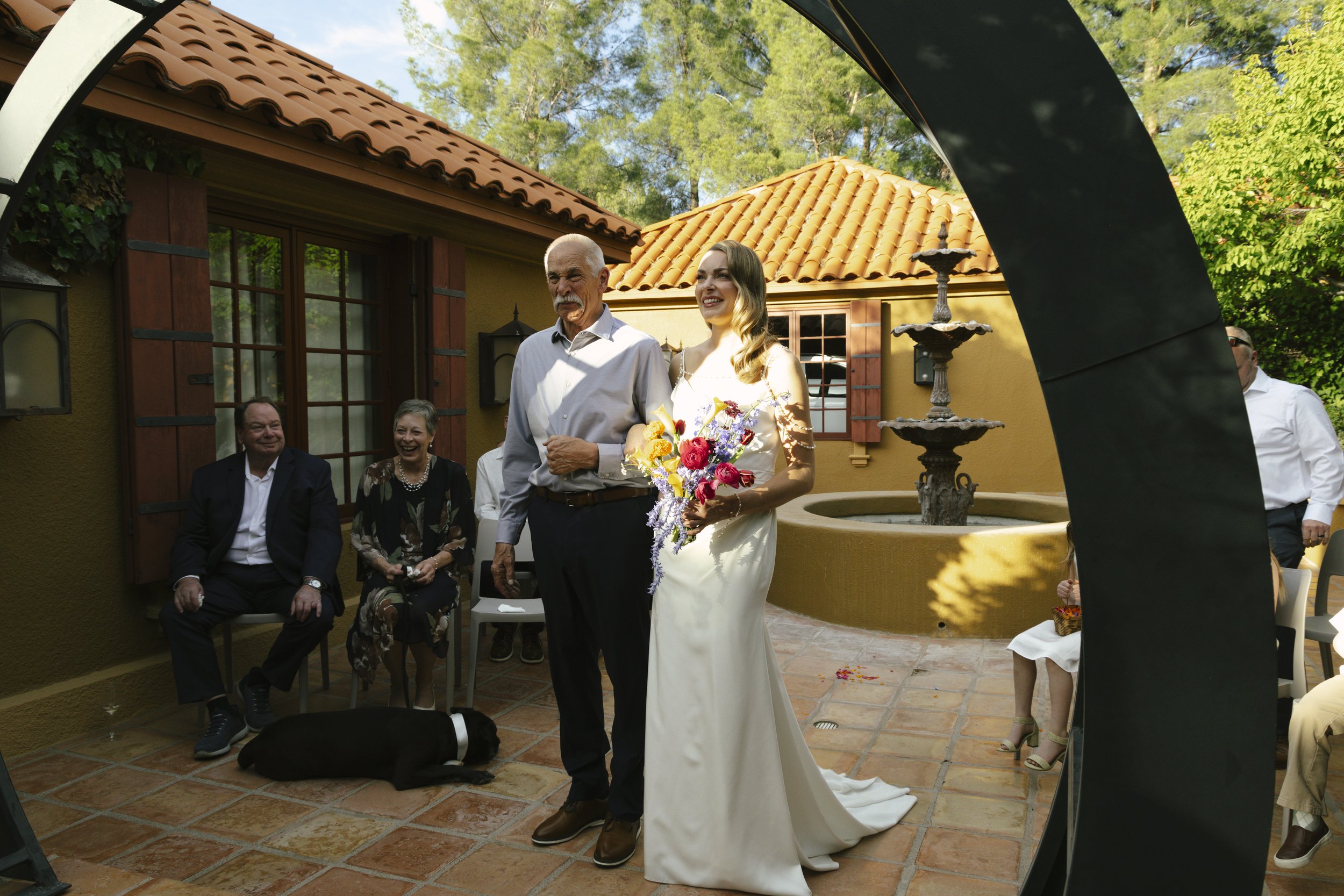 Chelsea and Travis exchanged heartfelt vows during their intimate Sedona elopement at a private Arizona home, surrounded by their closest family, friends, and beloved dog. Their outdoor ceremony was filled with meaningful moments, personal vows, and 
