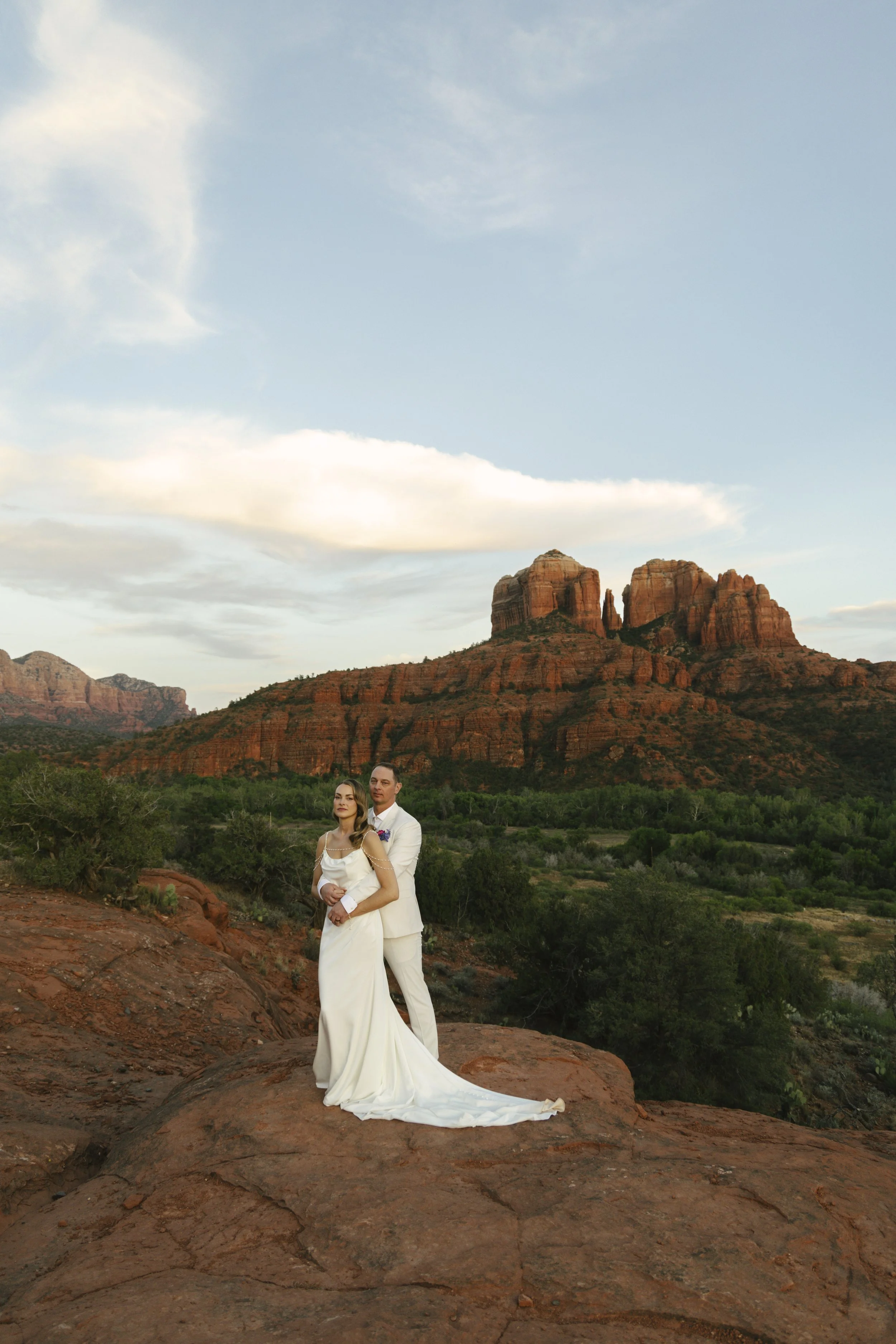 Romantic golden hour portraits at Secret Slick Rock during Chelsea and Travis' intimate Sedona elopement. Featuring Sedona's famous red rock views, stunning Arizona desert landscapes, and timeless wedding photography, these newlywed portraits perfect