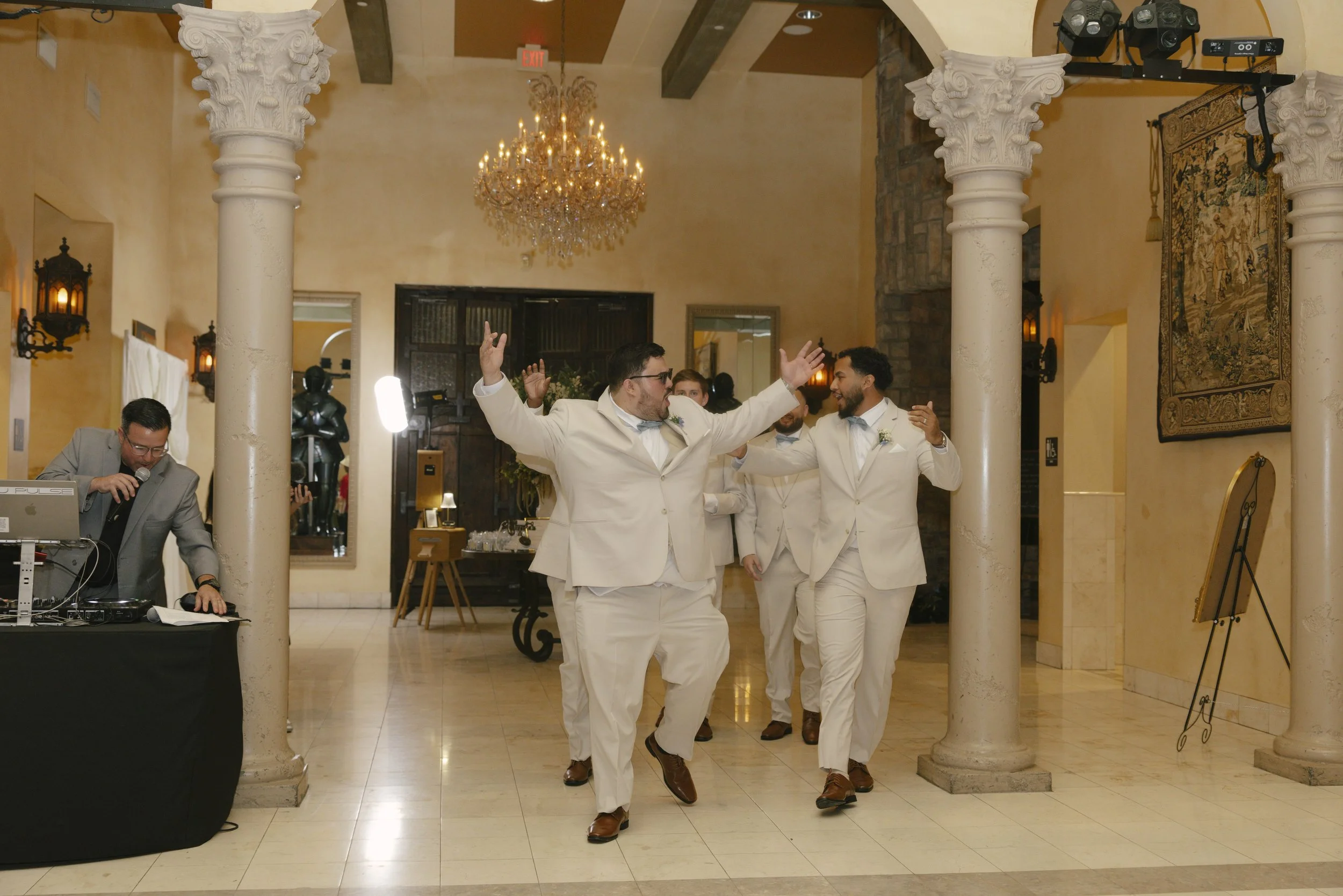 The reception celebration at Ashley Castle in Chandler, Arizona, came to life through hybrid film and digital photography, capturing elegant reception details, joyful bridal party entrances, and lively dance floor moments inside the castle’s grand ba