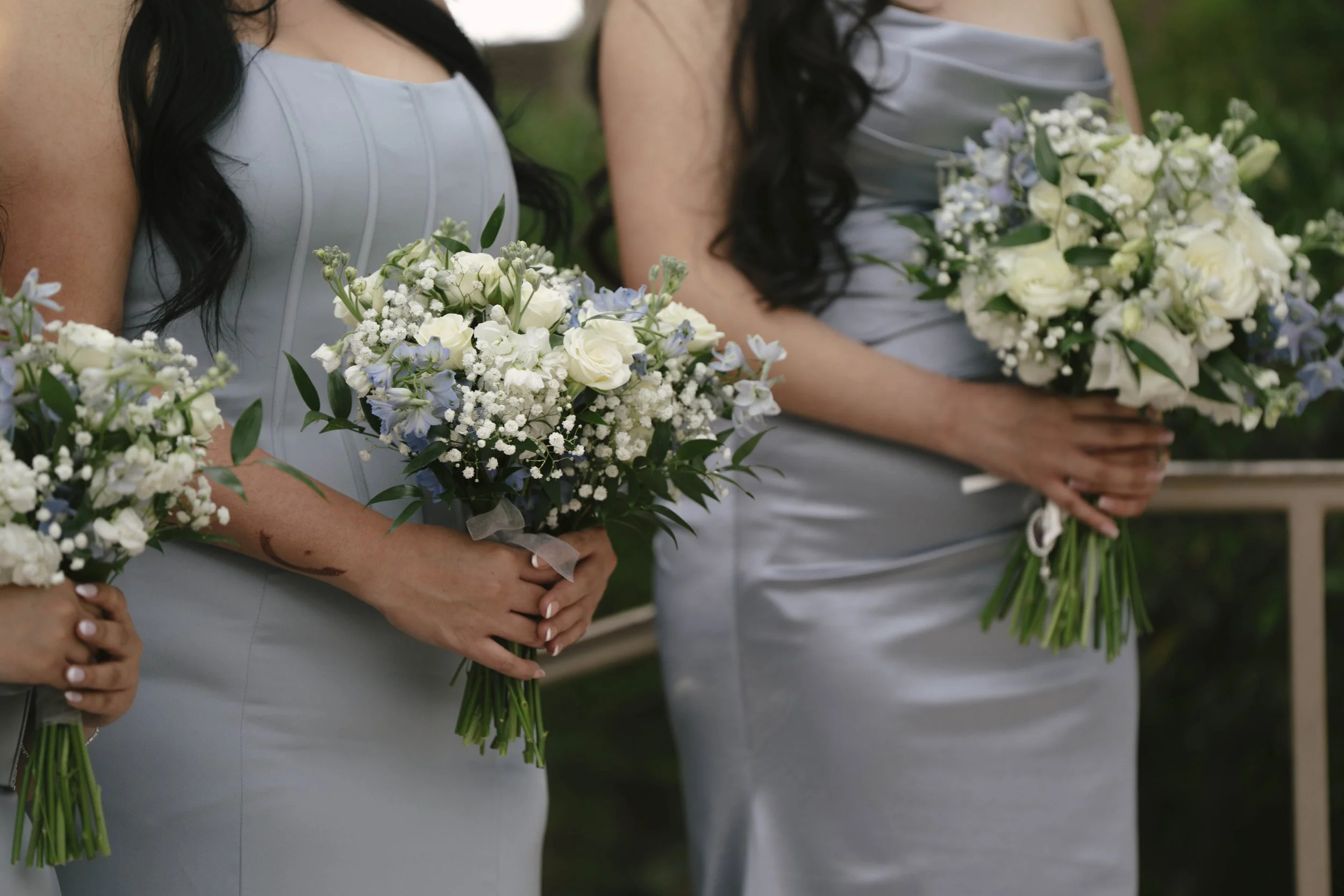 The bride and groom’s ceremony at Ashley Castle in Chandler, Arizona, was beautifully documented through hybrid film and digital photography, capturing their vows, ring exchange, and heartfelt moments beneath a romantic floral altar in the castle’s e