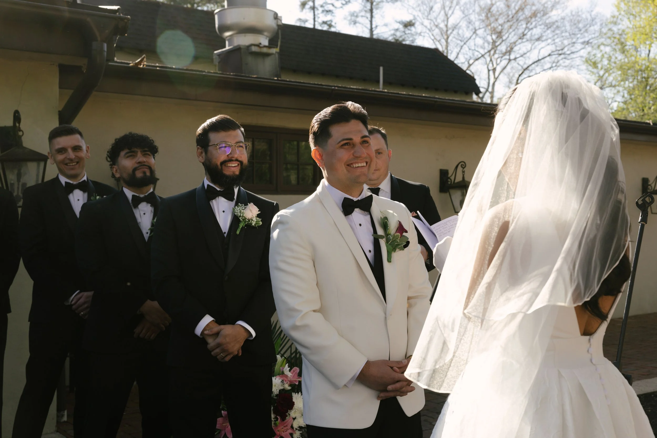 Outdoor wedding ceremony at Hotel DuVillage featuring the bride and groom, wedding party, and meaningful moments captured on both digital and 35mm film. A timeless celebration documented with a candid, documentary approach