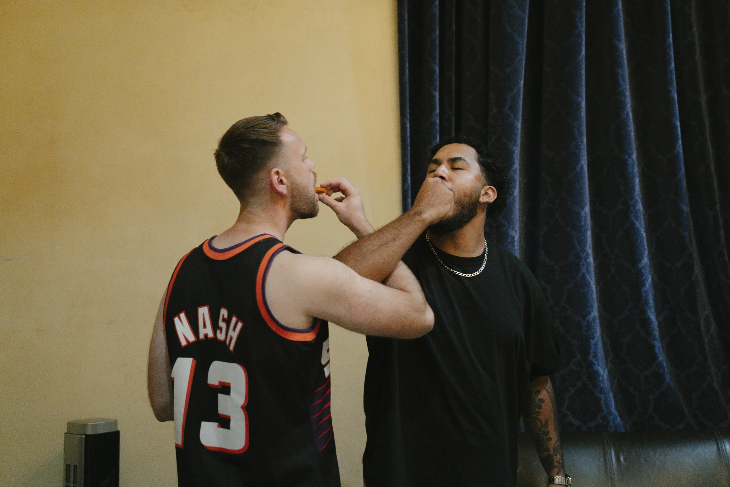 The groom’s getting-ready moments at Ashley Castle in Chandler, Arizona, capture the energy and anticipation of the wedding day, documented through hybrid film and digital photography to preserve both candid emotion and timeless detail inside this el