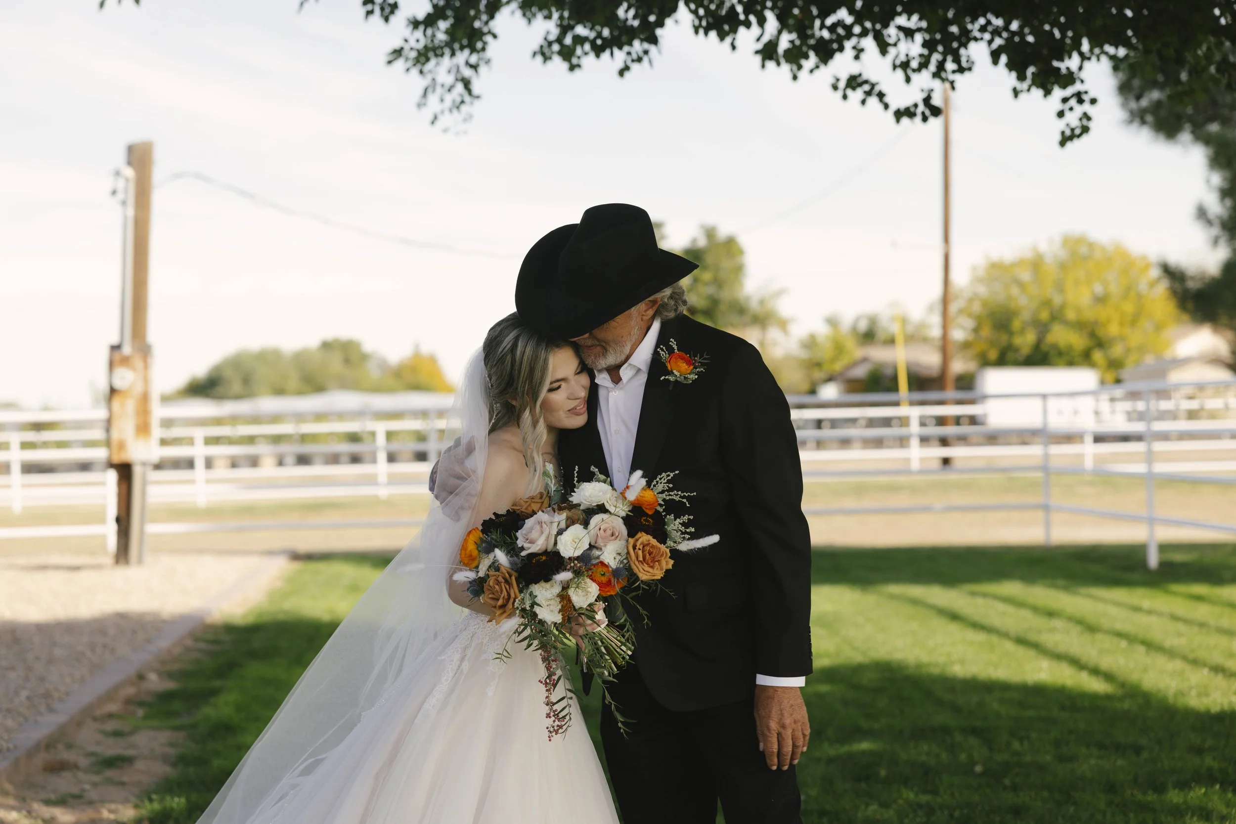 Candid wedding photography from a December wedding at The Knotty Barn in Queen Creek, Arizona, photographed by Raw By Laura, highlighting natural emotion, rustic details, and warm desert tones.