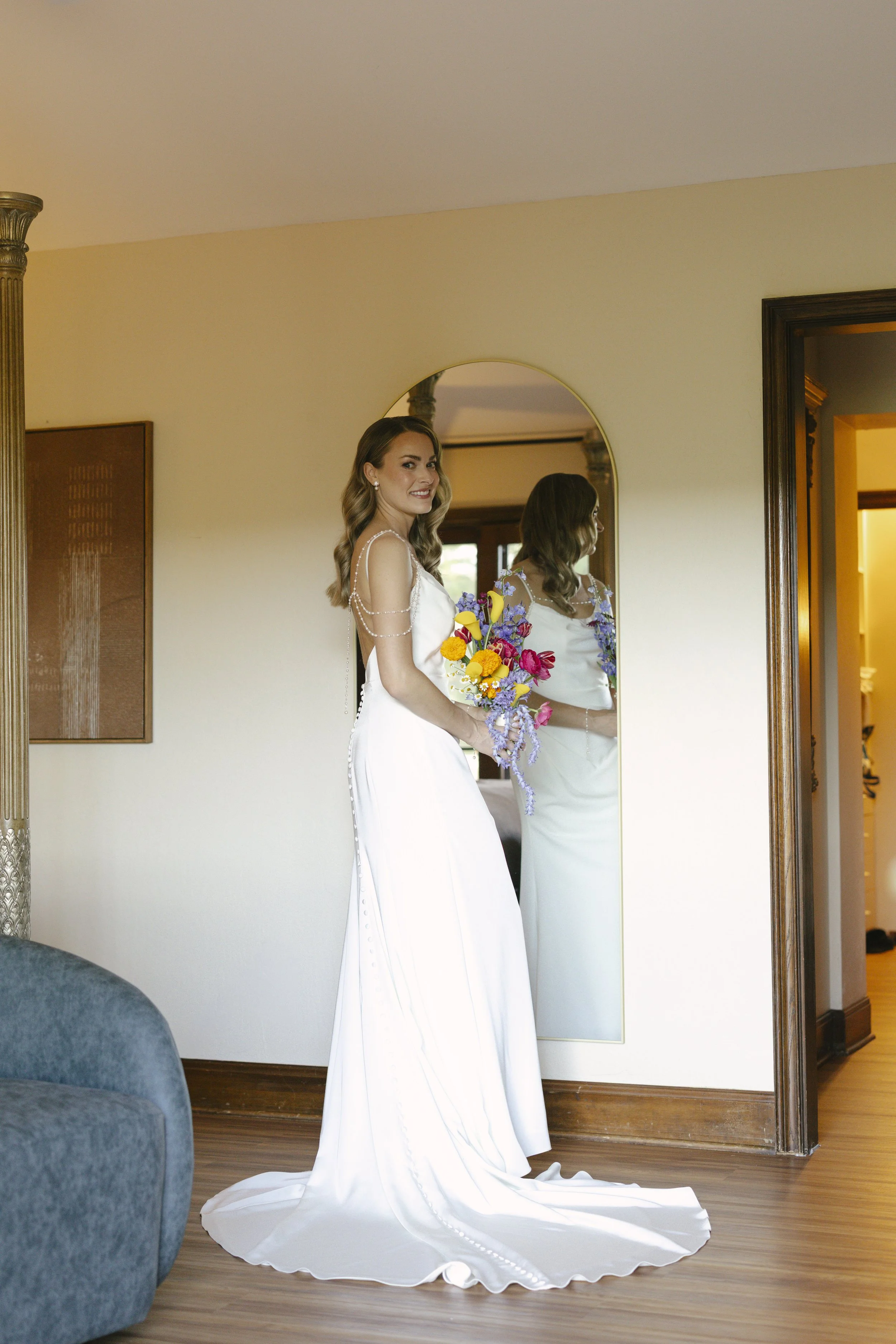 Chelsea and Travis' intimate Sedona elopement continued with heartfelt bridal getting-ready moments as the bride shared meaningful time with her mother and closest loved ones. From fastening her wedding dress and adding the finishing touches to quiet