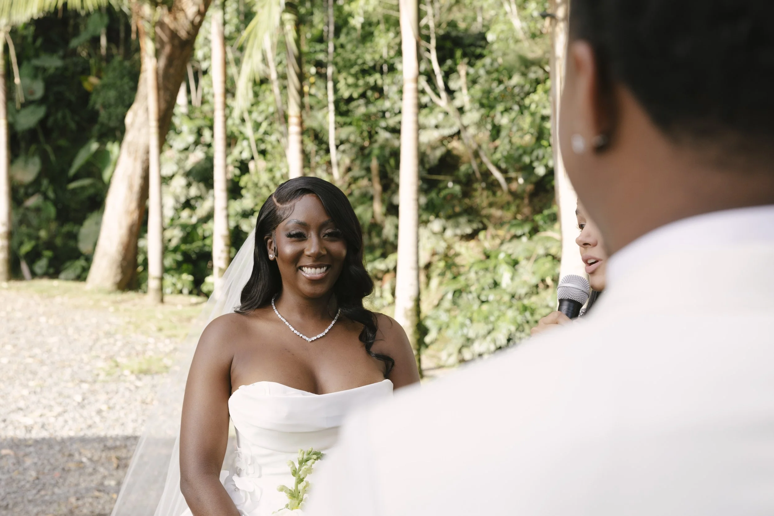 Forest Campestre wedding ceremony in Medellín, Colombia featuring the bridal processional, groom's reaction, emotional ceremony moments, floral aisle design, wedding guests, and documentary-style wedding photography