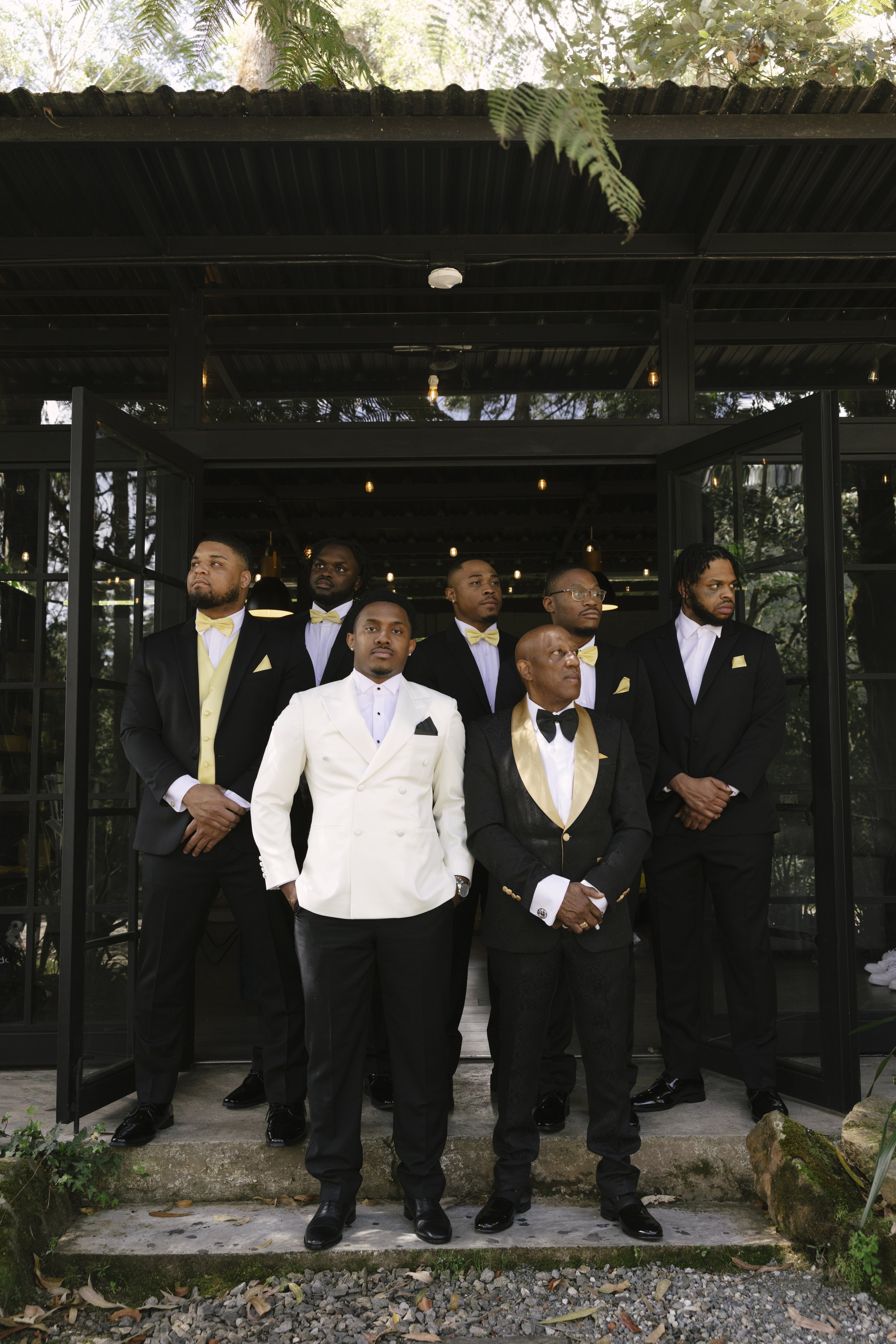 Destination wedding groom portraits at Forest Campestre in Medellín, Colombia featuring modern wedding attire, groomsmen portraits, formal wedding party photos, and documentary wedding photography