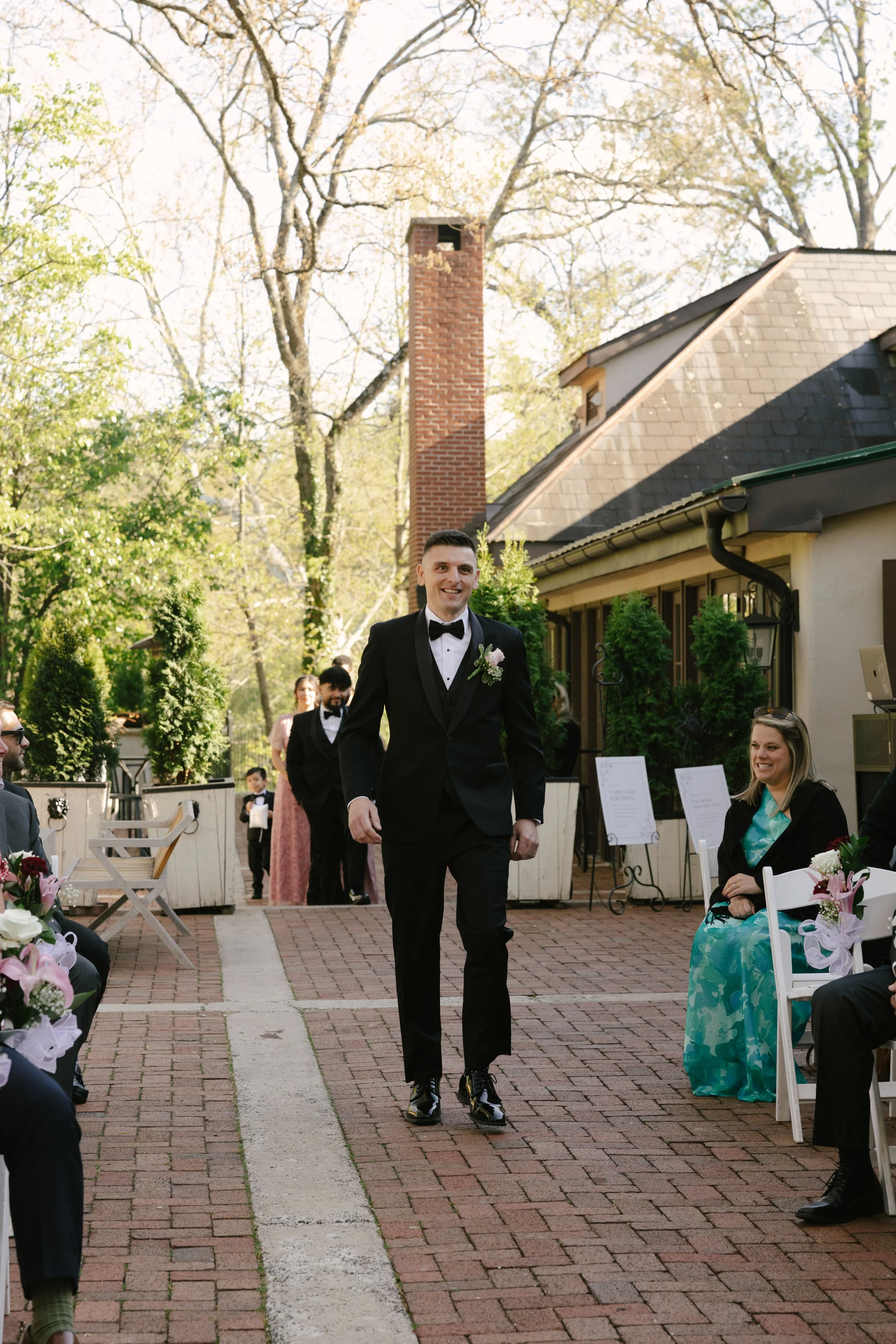 Outdoor wedding ceremony at Hotel DuVillage featuring the bride and groom, wedding party, and meaningful moments captured on both digital and 35mm film. A timeless celebration documented with a candid, documentary approach