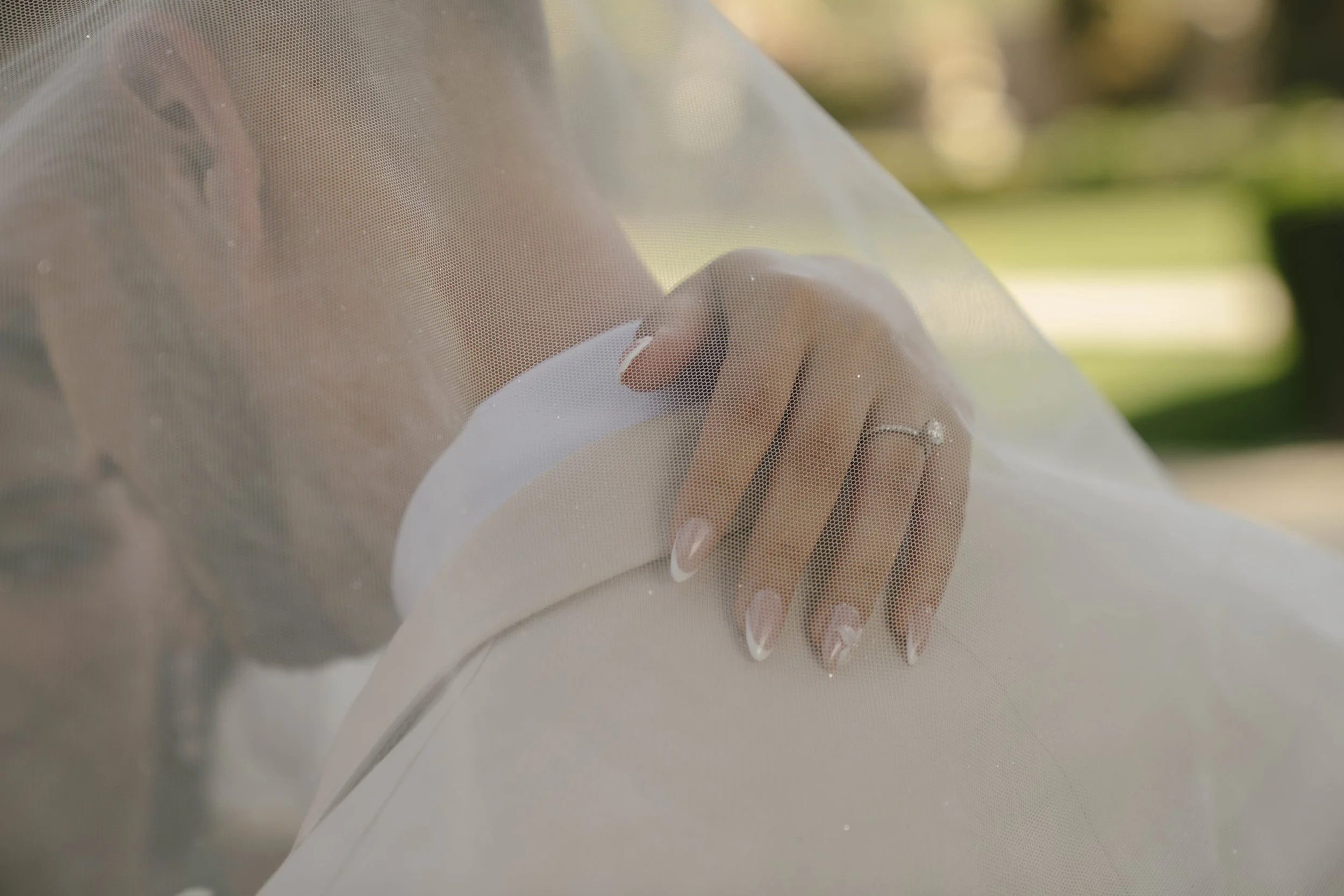 Romantic bride and groom portraits at Ashley Castle in Chandler, Arizona, captured through hybrid film and digital photography, showcase intimate newlywed moments filled with emotion, elegant garden backdrops, and timeless wedding-day connection.